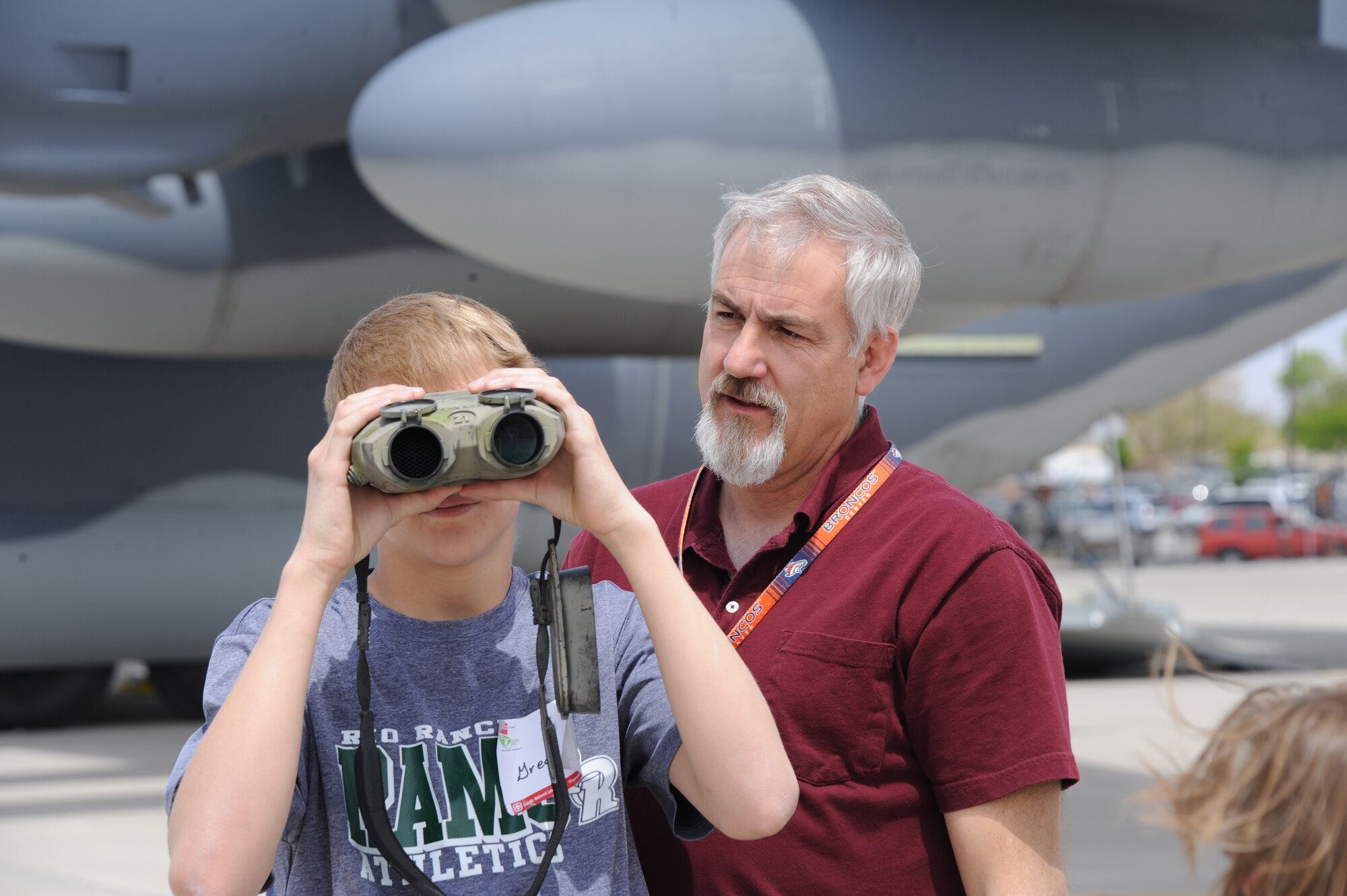 As part of “Take Our Daughters and Sons to Work Day,” employees were invited to bring their children to the base to learn more about Kirtland missions. A participant samples VECTOR rangefinder binoculars. They measure range, angles, horizontal distance, and height difference.  (Photo by Todd Berenger)
