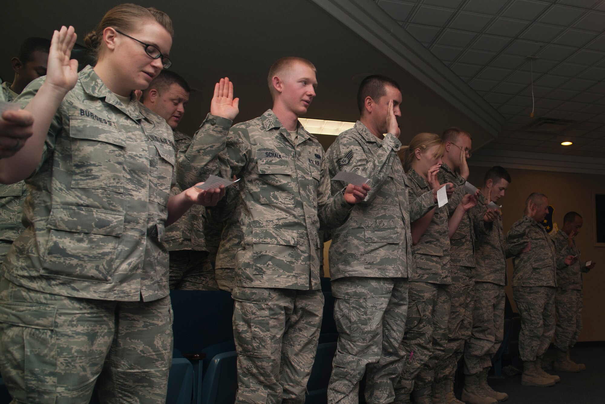 Members of Team Holloman participate in an oath ceremony at Holloman Air force Base, N.M., May 3. Members pledged to either complete 30 hours of volunteer service or remain alcohol-free for 30 days from May 5 to June 6. This Alcohol Abstinence and Volunteerism Challenge hopes to increase community involvement and decrease the number of drunken driving incidents in the wing. (U.S. Air Force photo by Airman 1st Class Leah Murray/Released)