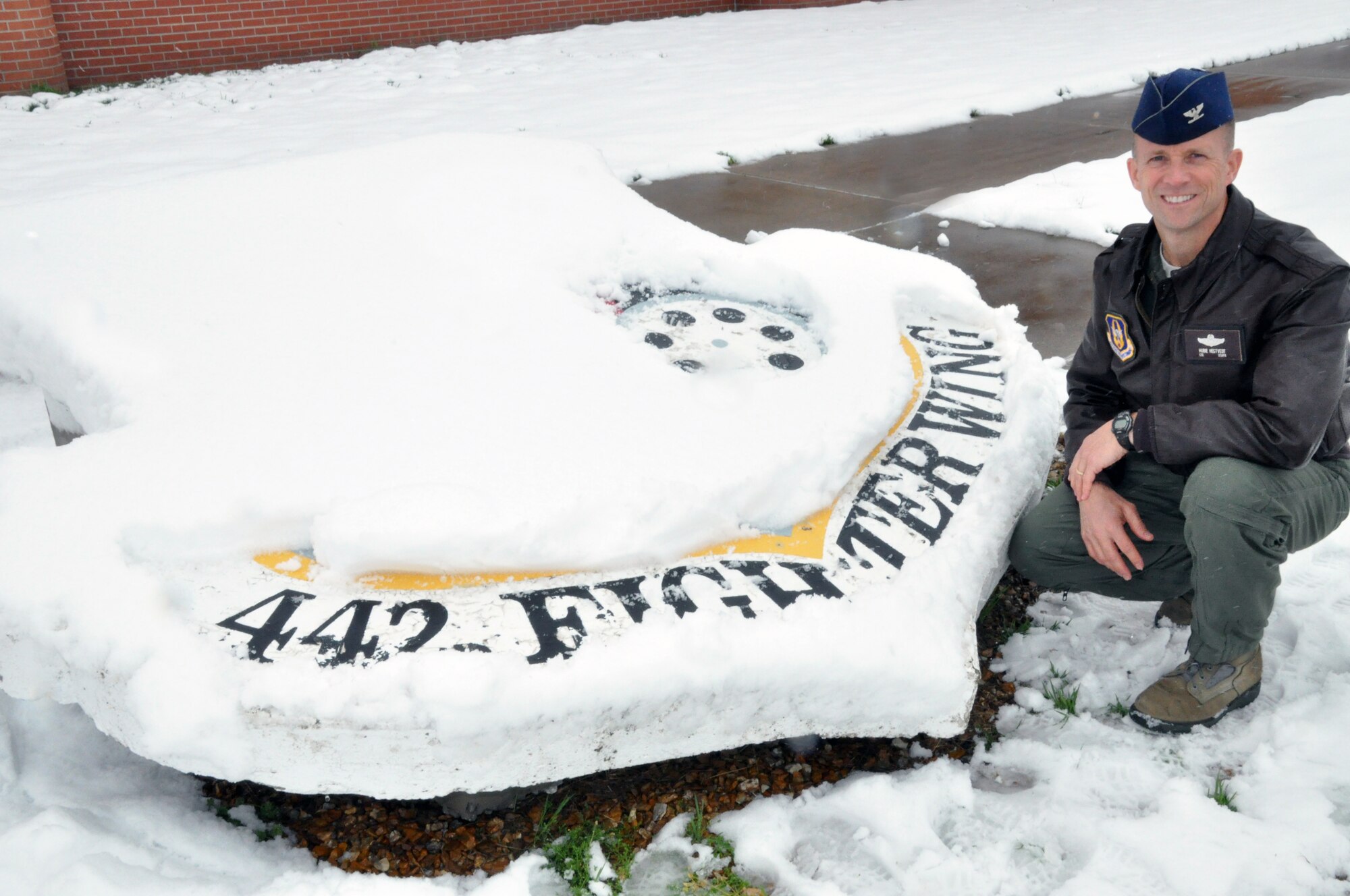 Col. Hubie Hegtvedt, 442nd Fighter Wing commander, sits in front of the shield during a snowy day May 3, 2013. Hegtvedt took command of the wing in April. The 442nd Fighter Wing is an A-10 Thunderbolt II Air Force Reserve unit at Whiteman Air Force Base, Mo. (U.S. Air Force photo by Tech. Sgt. Danielle Johnston/Released)