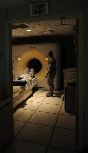 Senior Airman Natisha Haynie, 2nd Medical Support Squadron diagnostic imaging technologist, completes a computed tomography scan at the radiology lab on Barksdale Air Force Base, La., May 3, 2013. CT scanners provide an in-depth look into a patient's body and provide detailed images for doctor's to properly diagnose what may be wrong. (U.S. Air Force photo/Airman 1st Class Benjamin Gonsier)