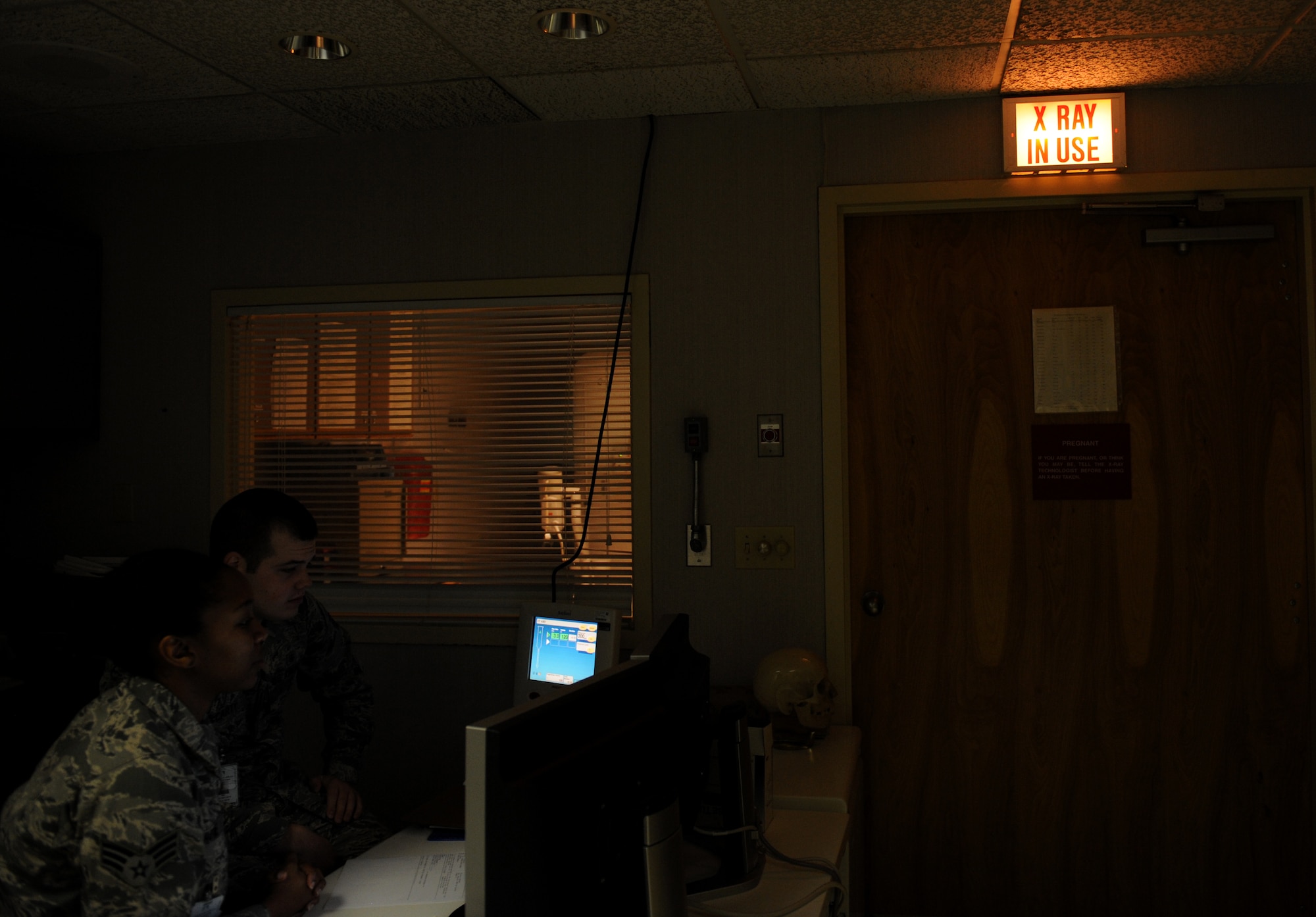 An illuminated sign notifies Airmen that a machine is currently emitting X-radiation at the radiology lab on Barksdale Air Force Base, La., May 3, 2013. Radiology technicians specialize in machines that see the deepest parts of the body and provide medical imaging to doctors. (U.S. Air Force photo/Airman 1st Class Benjamin Gonsier)
