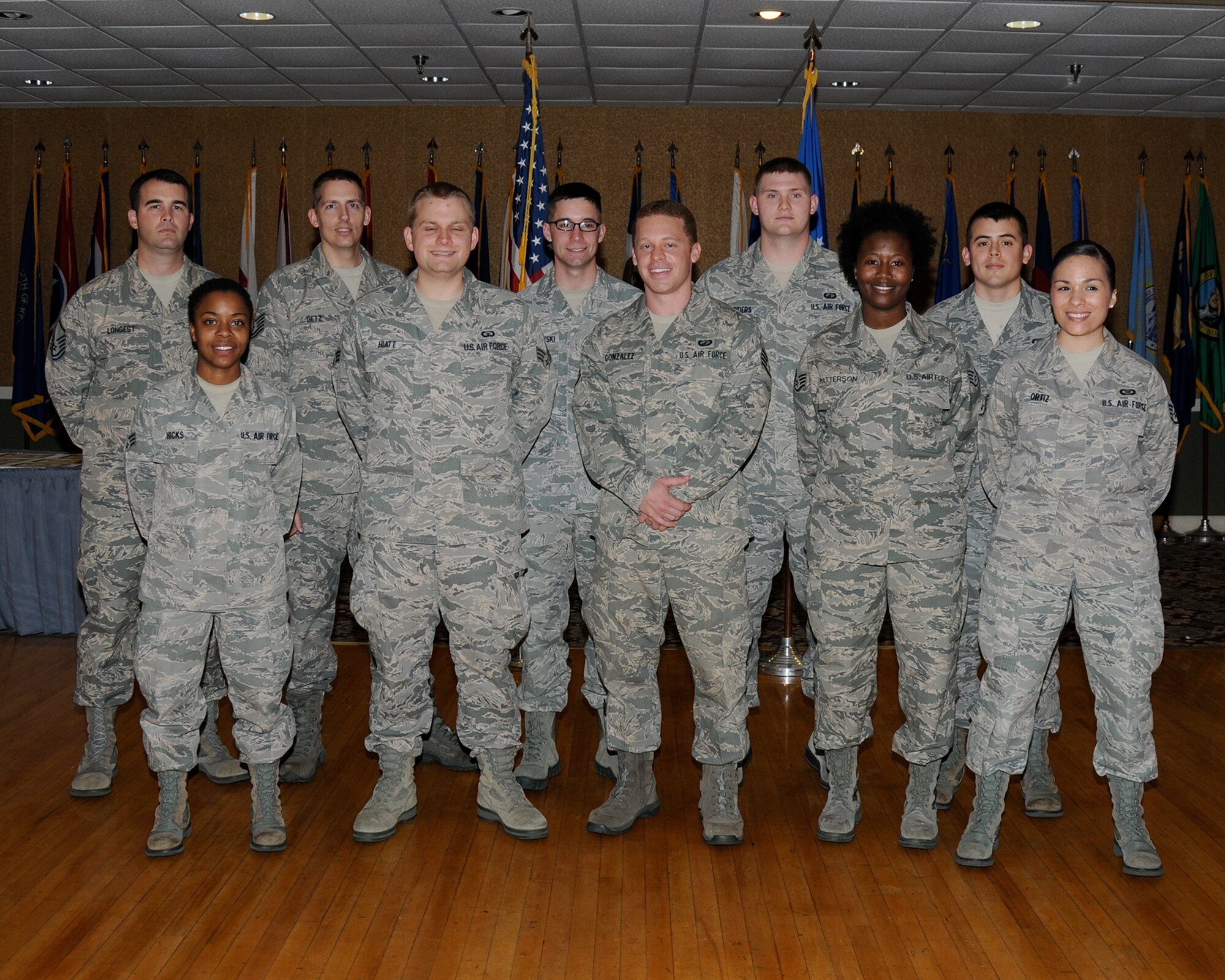 Nine of Team BLAZE’s newly promoted enlisted Airmen sewed on their next stripe at the enlisted promotions ceremony at the Columbus Club April 30.  (U.S. Air Force Photo/Sharon Ybarra)