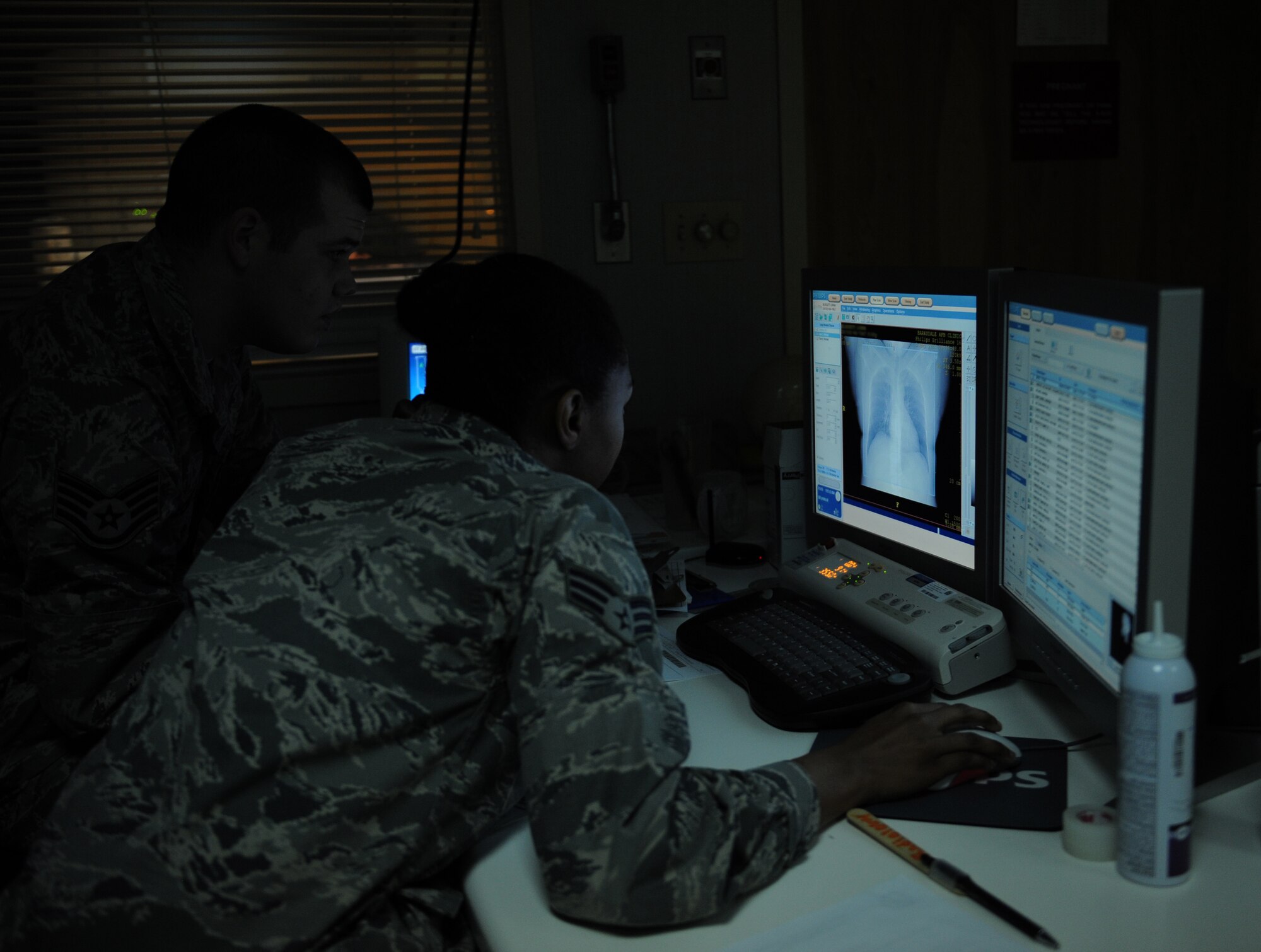 Staff Sgt. Sean McCarty and Senior Airman Natisha Haynie, 2nd Medical Support Squadron diagnostic imaging technologists, view an image from a computed tomography scan at the radiology lab on Barksdale Air Force Base, La., May 3, 2013. The images provide an in-depth look into a patient's body and provide detailed images for doctor's to properly diagnose what may be wrong. (U.S. Air Force photo/Airman 1st Class Benjamin Gonsier)
