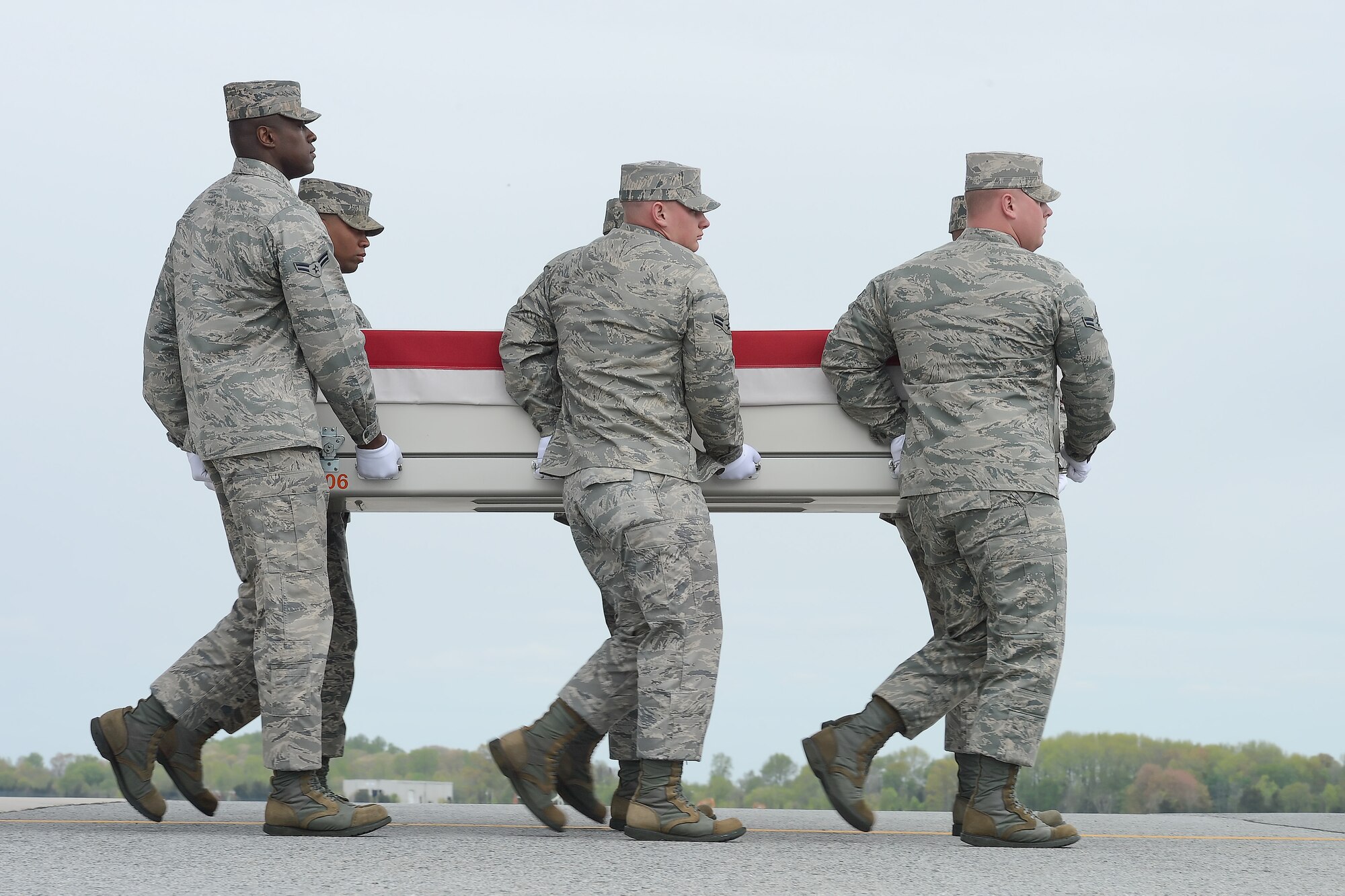 A U.S. Air Force carry team transfers the remains of Staff Sgt.Richard A. Dickson,  of Rancho Cordova, Calif., during a dignified transfer, April 30, 2013, Dover Air Force Base, Del. Dickson was assigned to the 306th Intelligence Squadron, Beale AFB, Calif. (U.S. Air Force photo/Greg L. Davis)