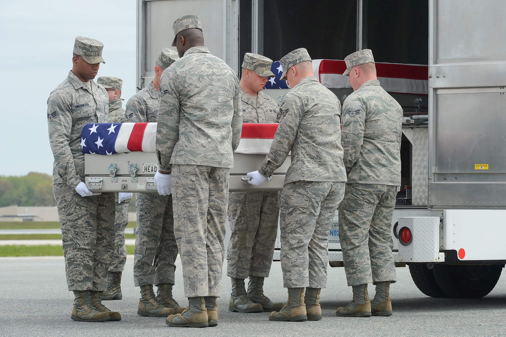 A U.S. Air Force carry team transfers the remains of Staff Sgt. Daniel N. Fannin, of Morehead, Ky., during a dignified transfer, April 30, 2013, Dover Air Force Base, Del. Fannin was assigned to the 552nd Operations Support Squadron, Tinker AFB, Okla. (U.S. Air Force photo/Greg L. Davis)