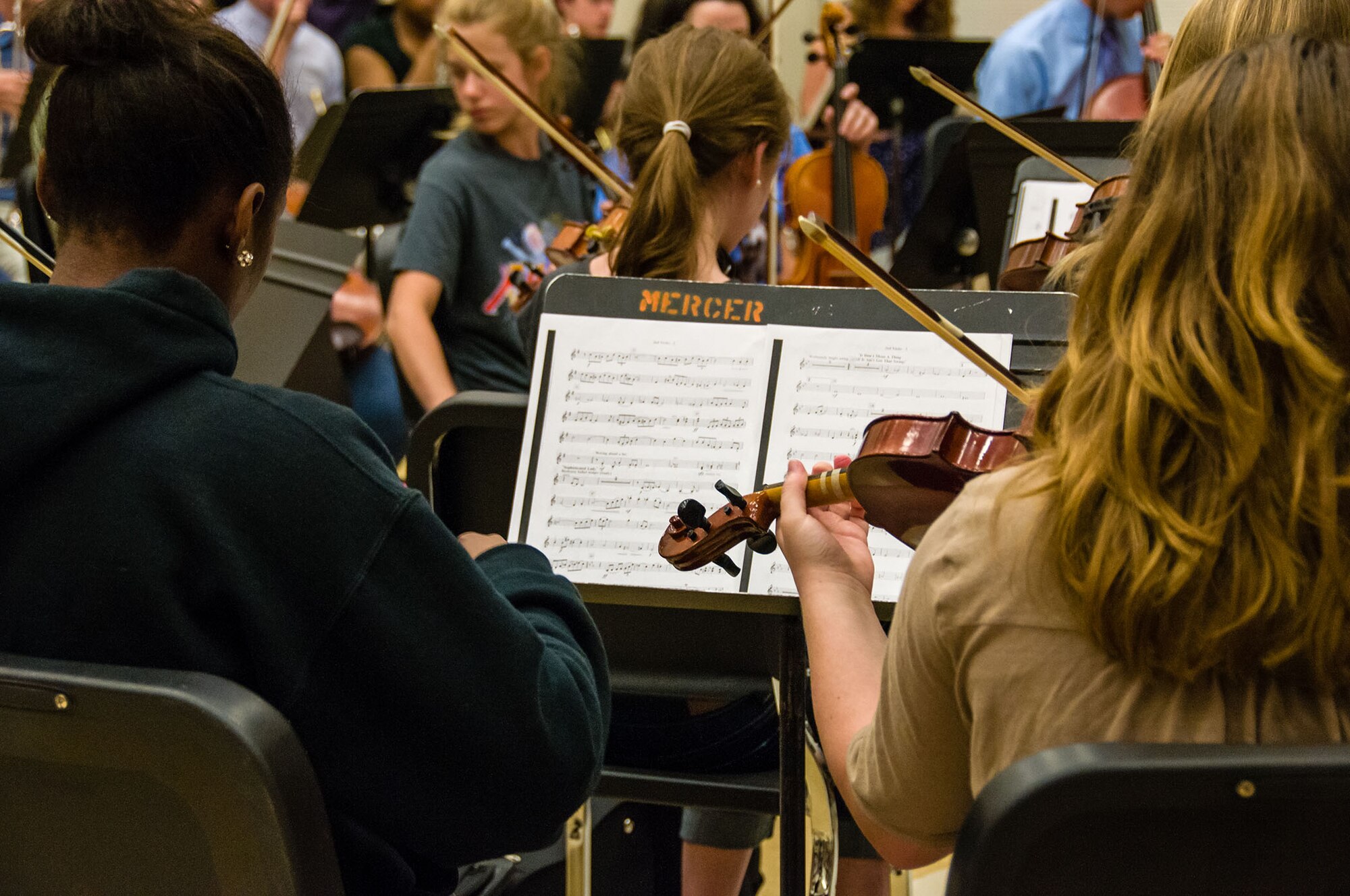 Macon Symphony Youth Orchestra students play from sheet music in preparation for the Kaleidoscope Concert May 4, 2013. The musical organization provides extensive rehearsal and performance opportunities to young musicians. MSYO is comprised of approximately 85 students, ages 9 to 18, representing more than 30 schools in the Macon, Warner Robins, Perry and surrounding areas in Middle Georgia.