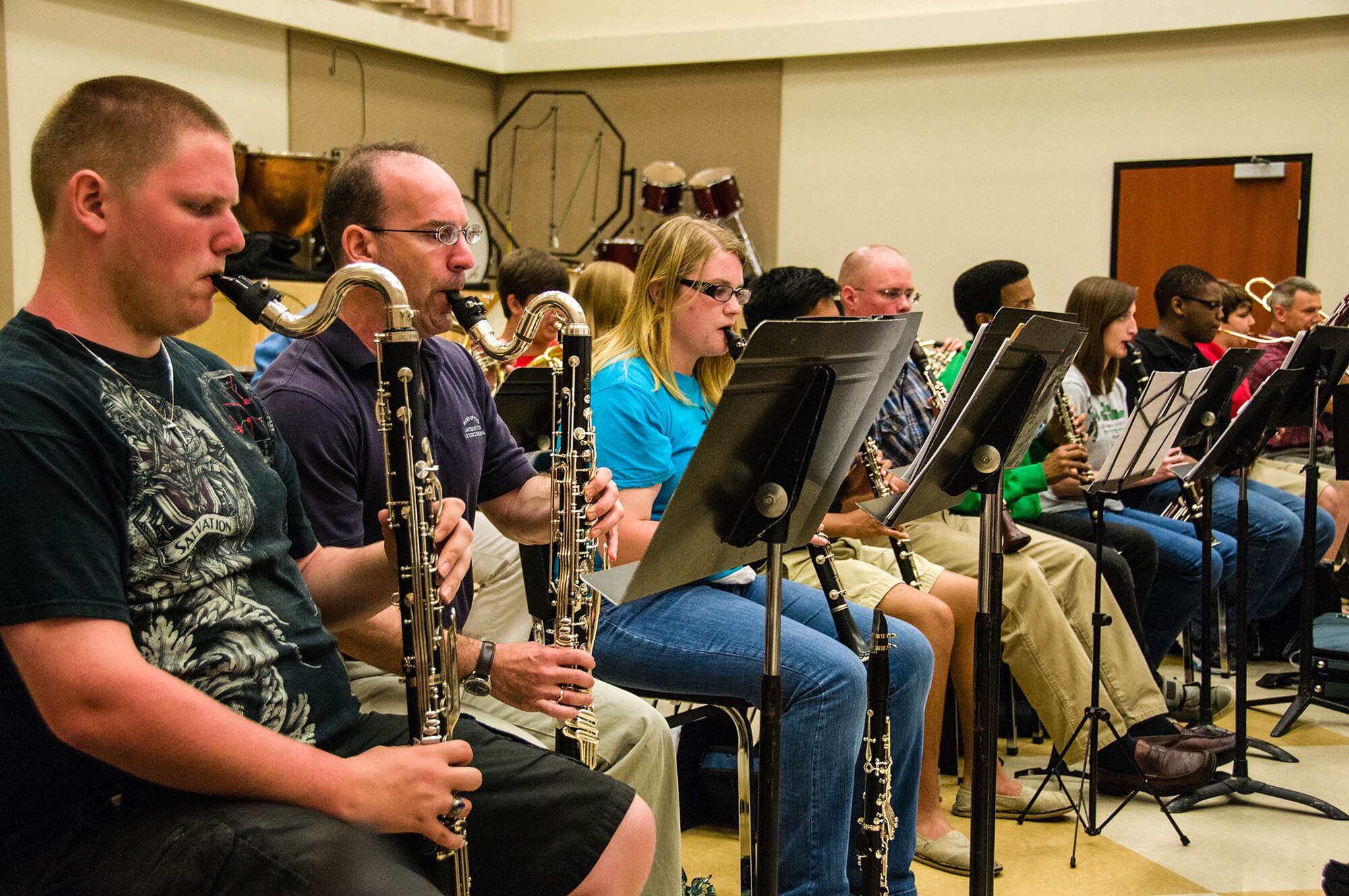 Members from the Band of the U.S. Air Force Reserve collaborate with the Macon Symphony Youth Orchestra in preparation for the Kaleidoscope Concert. The common concert style will showcase a variety of musical styles and ensembles, including orchestral works, chamber groups, duos, and solo performances by MSYO scholarship competition winners. This is the second time the groups have performed together and will be the last public performance for the Reserve Band before their unit inactivates Sept. 30, 2013. (U.S. Air Force photo/Staff Sgt. Alexy Saltekoff)