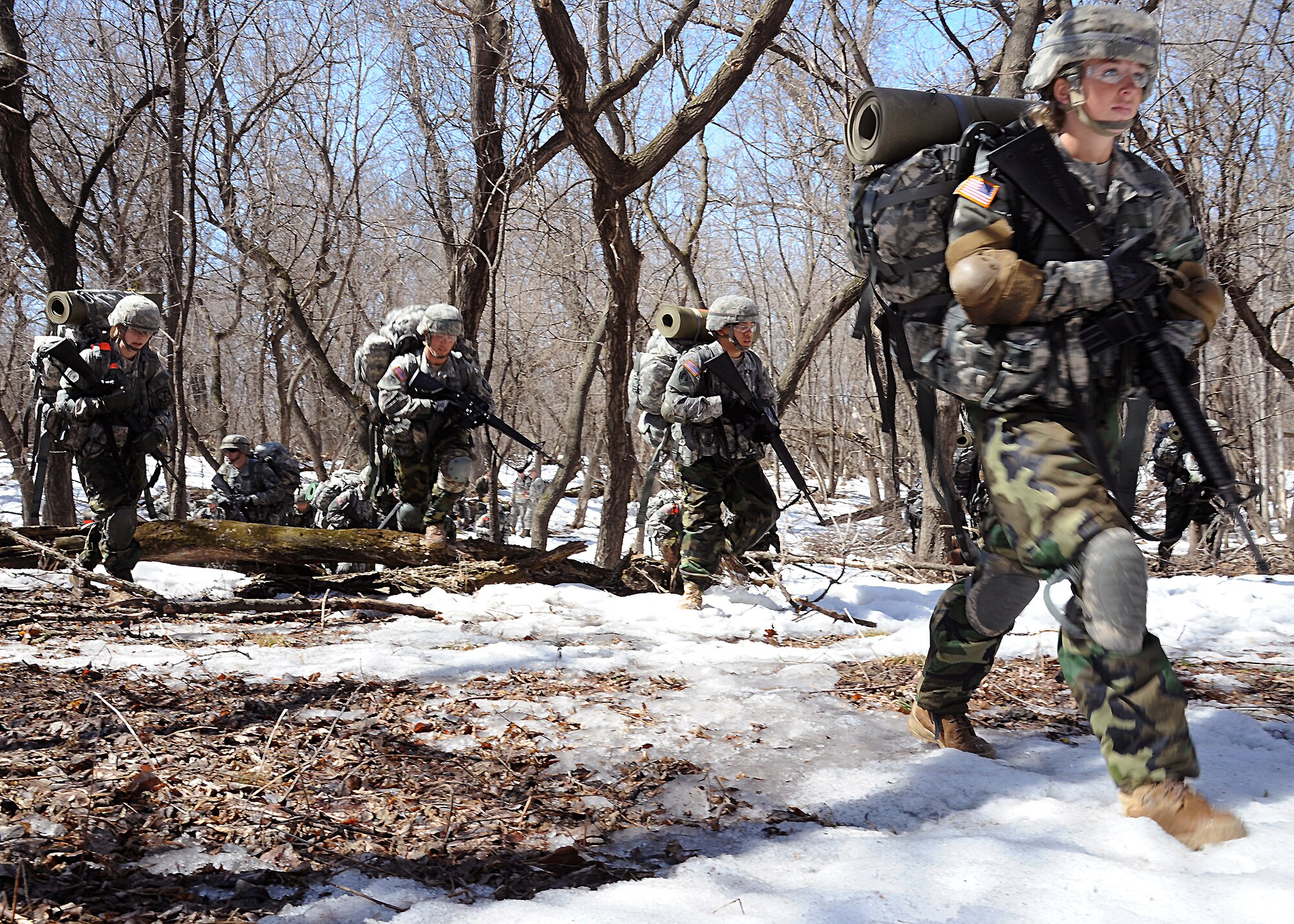 University of North Dakota Army Reserve Officer Training Corps cadets navigate to their next site during a patrolling exercise April 26, 2013 on Grand Forks Air Force Base, N.D. The exercise is designed to test the cadets' abilities to lead, plan, coordinate and execute complicated missions under stress and time constraints.  (U.S. Air Force photo/Airman 1st Class Xavier Navarro)
