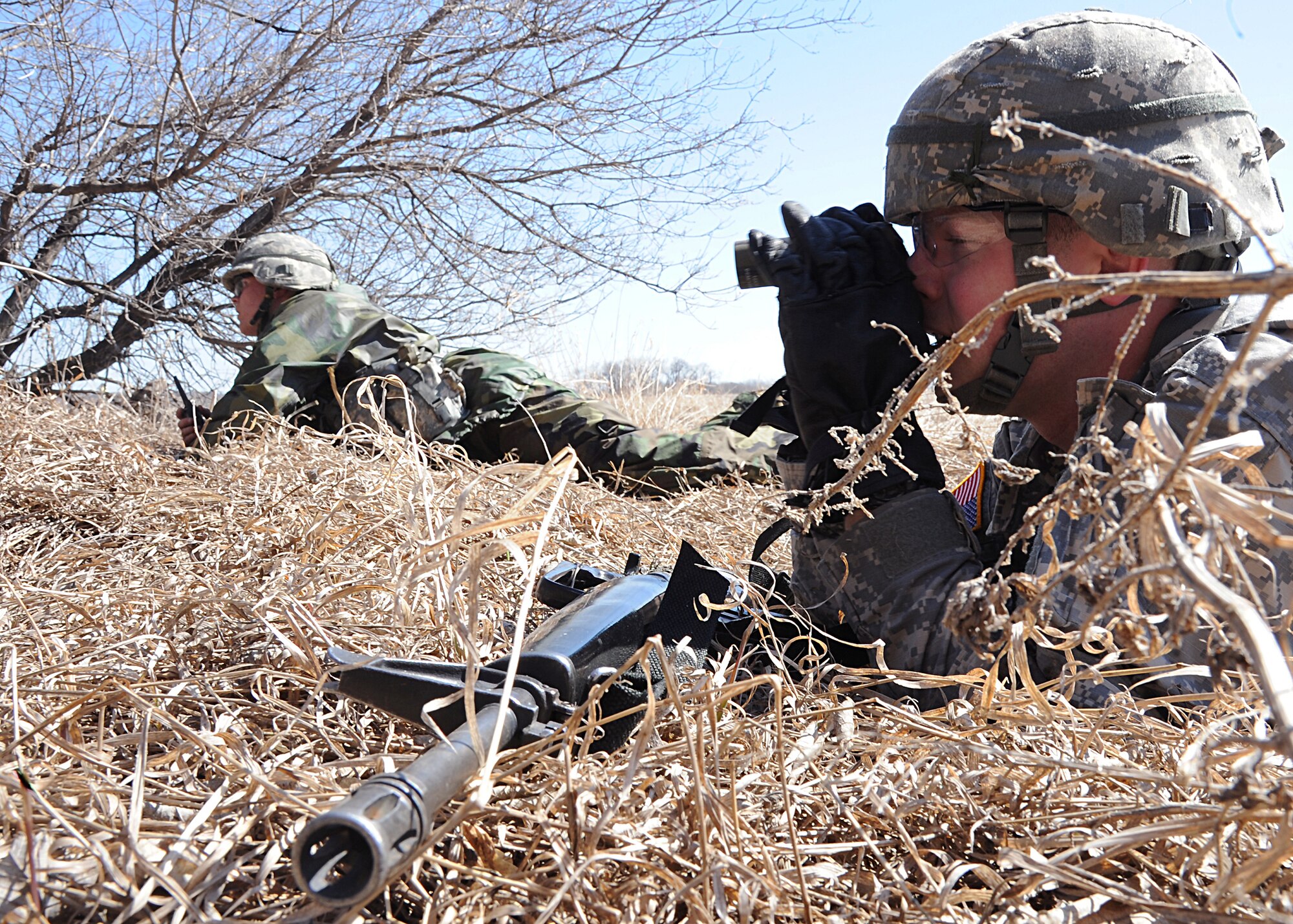 University of North Dakota Army Reserve Officer Training Corps cadets scout for "hostile forces" during a patrolling exercise April 26, 2013 on Grand Forks Air Force Base, N.D. The exercise was designed for cadets to rotate job positions to assess their leadership capabilities in the field. (U.S. Air Force photo/Airman 1st Class Xavier Navarro) 