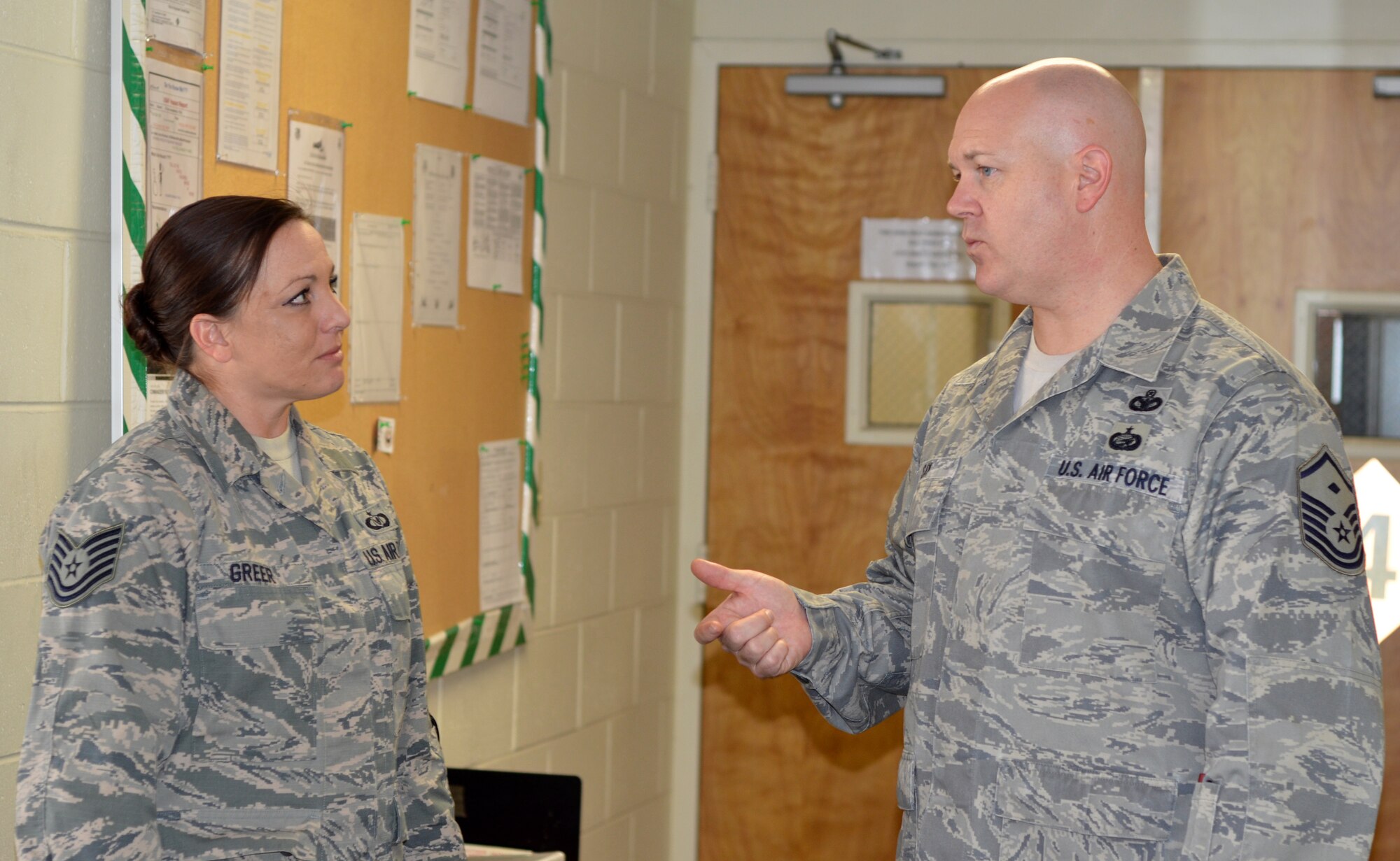 Master Sgt. David Say, Reserve first sergeant at the 920th Rescue Wing's Operational Support Squadron here, speaks with Tech. Sgt. Stacie Greer during a Unit Training Assembly. Say's primary job as the first sergeant is to hand out advice, help fix problems or find solutions, be the disciplinarian when necessary and generally watch out for the health and welfare of all members of the squadron. (U.S. Air Force photo/2nd Lt. Leslie Forshaw)