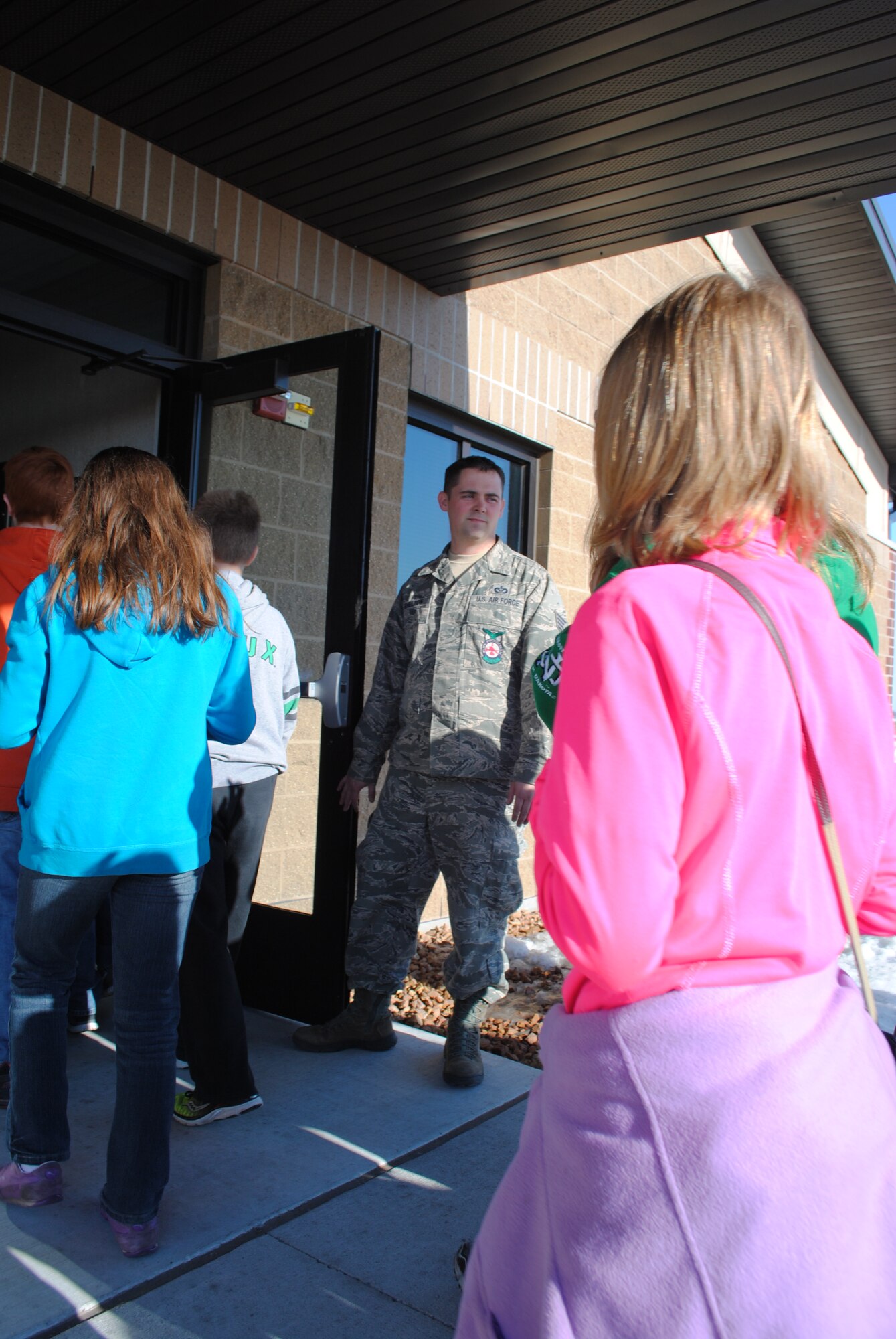 Staff Sgt. William Shelton, 319th Civil Engineer Squadron, welcomes 5th- and 6th-grade students from St. Joseph’s Catholic School in Devils Lake, N.D., to the fire department on Grand Forks Air Force Base, N.D., during an April 26 tour. Grand Forks AFB offers base tours each Friday from March through November.  (U.S. Air Force photo/Staff Sgt. Luis Loza Gutierrez)