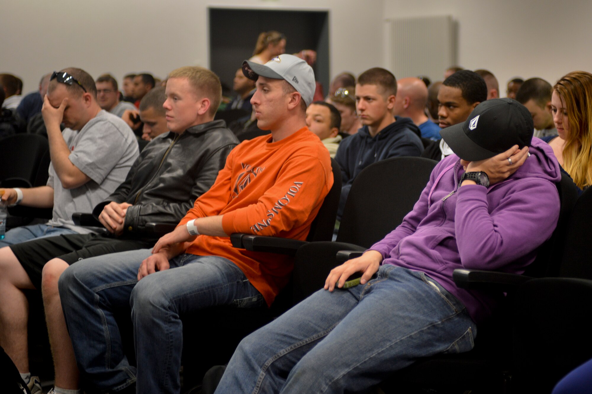 “Evacuees” listen to an introductory brief prior to in-processing during a readiness inspection on Ramstein Air Base, Germany, May 2, 2013. The purpose of this readiness inspection was to test Ramstein’s Airmen ability to safely evacuate and receive noncombatants from a hostile environment.  (U.S. Air Force photo/Airman 1st Class Jordan Castelan)