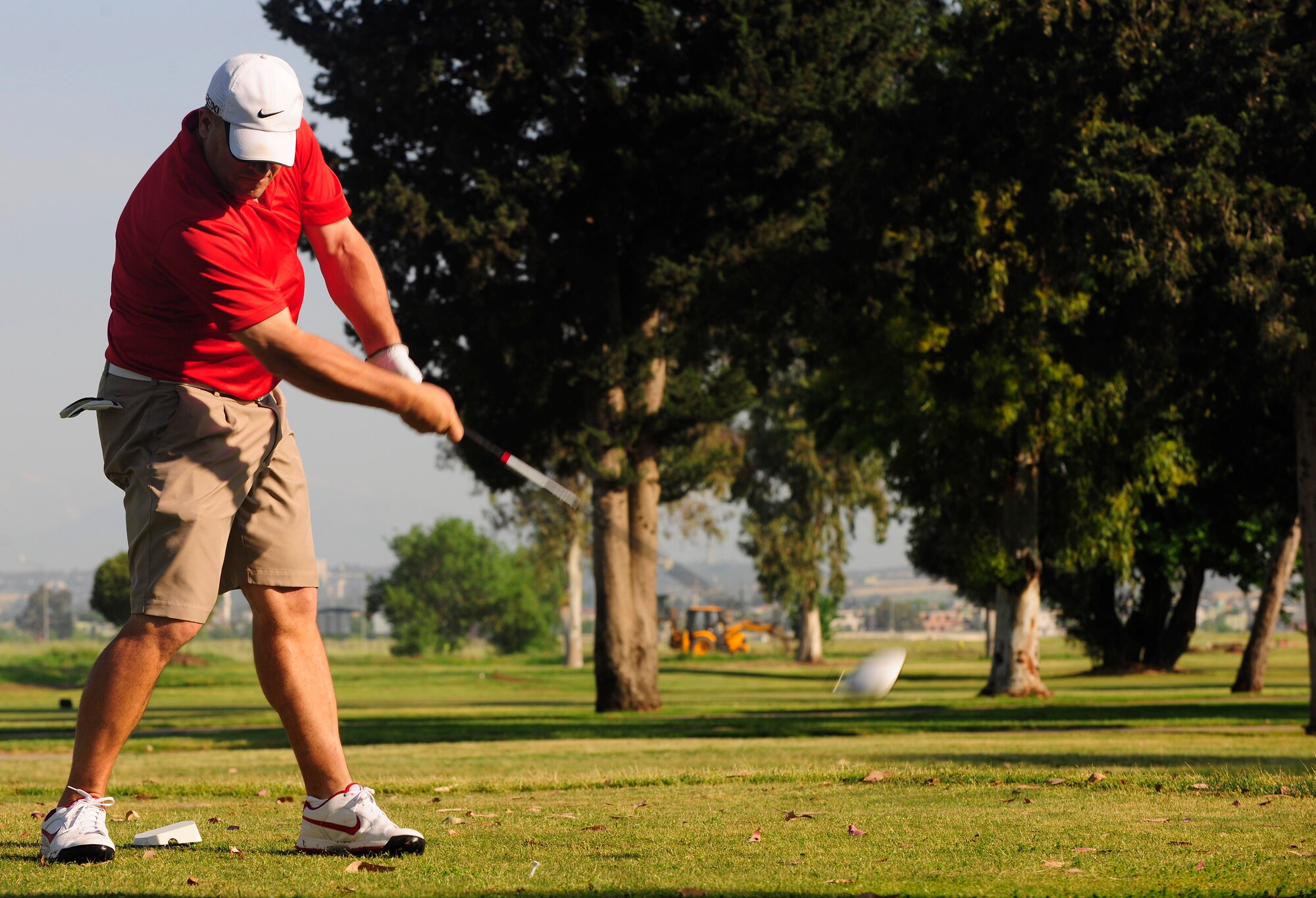 Master Sgt. Dustin Barnes, 39th Force Support Squadron manpower flight chief, makes a successful swing on a golf ball during the second annual Air Force Assistance Fund Golf Outing May 3, 2013, at Incirlik Air Base, Turkey. The event was put together to raise money for the AFAF during the final day of the 2013 campaign at Incirlik. (U.S. Air Force photo by Senior Airman Anthony Sanchelli/Released)
