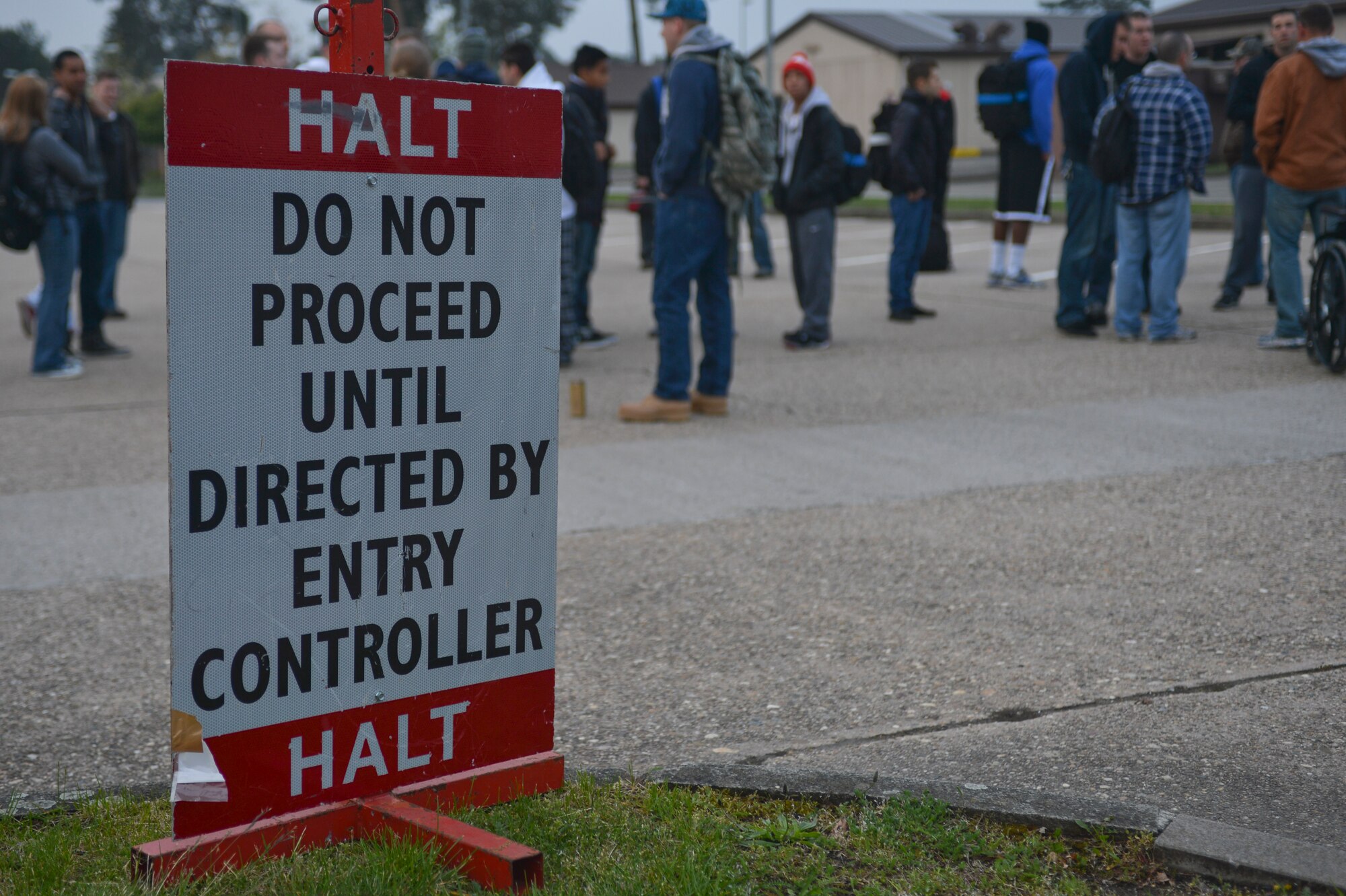 “Evacuees” wait to be processed into the Southside Fitness Center for lodging during readiness inspection on Ramstein Air Base, Germany, May 3, 2013. The purpose of this readiness inspection was to test Ramstein’s Airmen ability to safely evacuate and receive noncombatants from a hostile environment. (U.S. Air Force photo/Airman 1st Class Jordan Castelan)