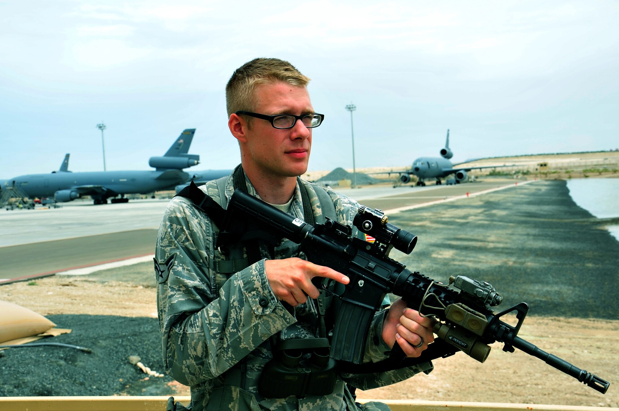 U.S. Air Force Airman 1st Class Nicholas Orsolini, 380th Expeditionary Security Forces Squadron defender, conducts a patrol on the flightline observation tower catwalk April 30, 2013. 380 ESFS "defenders" provide 24/7 security for base assets and personnel. Orsolini is deployed from Nellis Air Force Base, Nev., and is a native of Addison, Ill. (U.S. Air Force photo by Staff Sgt. Timothy Boyer)