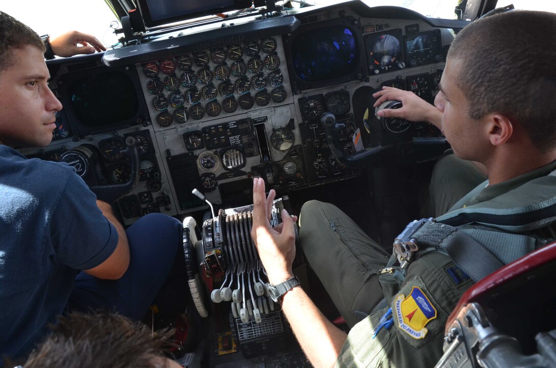 (Right) Capt. Michael Sydney, 23rd Expeditionary Bomb Squadron scheduler, briefs (left) Fire Capt. Eric Masur, 36th Civil Engineer Squadron Andersen Fire and Emergency Services captain, on safe egress procedures on Andersen Air Force Base, Guam, April 30, 2013. The training covered various safety mishaps associated with the B-52 Stratofortress and allowed members from the 23rd EBS and the 36th CES to share best practices regarding aircraft safety. (U.S. Air Force photo by Staff Sgt. Veronica McMahon/Released)