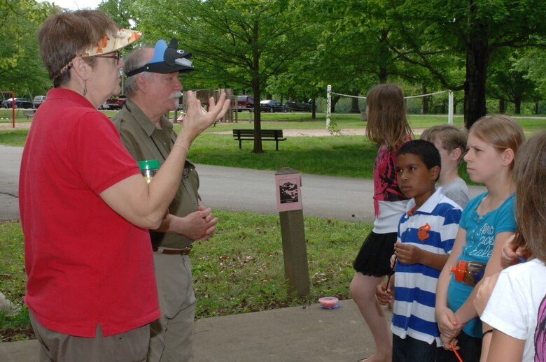 Kathy and Norman Dewein (Left), Austin Peay University Project Wet, use beads to explain the water cycle to West Cheatham Elementary School students on Environmental Awareness Day May 3, 2013 at Cheatham Lake in Ashland City, Tenn. The U.S. Army Corps of Engineers Nashville District organized and sponsored the event.