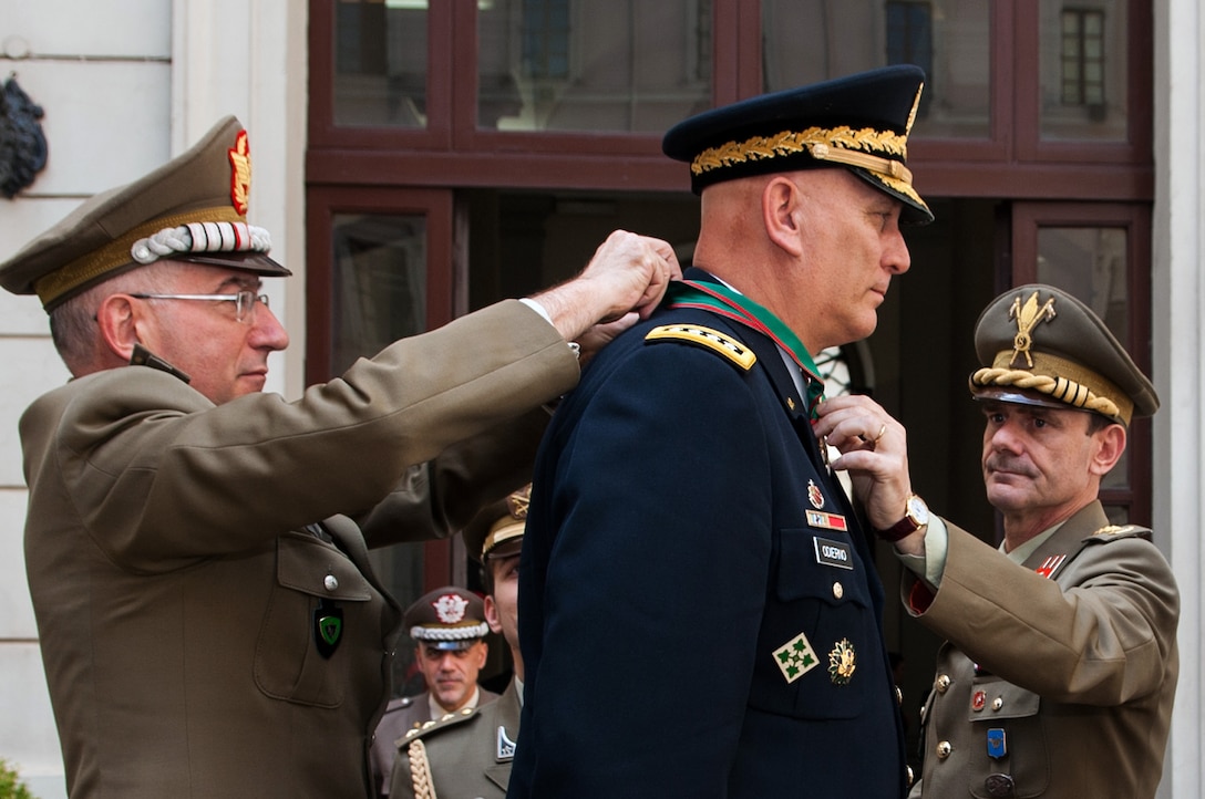 Italian army Chief of Staff Lt. Gen. Claudio Graziano, left, awards the Order of Merit of the Italian Republic to U.S. Army Chief of Staff Gen. Ray Odierno during a ceremony at the Italian army headquarters in Rome, May 2, 2013.