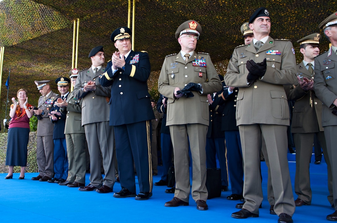 Italian army Chief of Staff Lt. Gen. Claudio Graziano, second from right, U.S. Army Chief of Staff Gen. Ray Odierno, center, and Italian army officers applaud after Italian soldiers conduct cavalry maneuvers at the Tor di Quinto Military Hippodrome in Rome, May 2, 2013. 