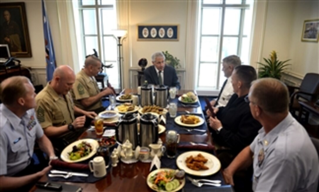 Secretary of Defense Chuck Hagel, center, hosts a lunch for the Senior Enlisted Advisors of each service and the Chairman of the Joint Chiefs of Staff in his Pentagon office on May 2, 2013.  Hagel used the first meeting with the group to listen to their concerns and about the challenges each service faces.   