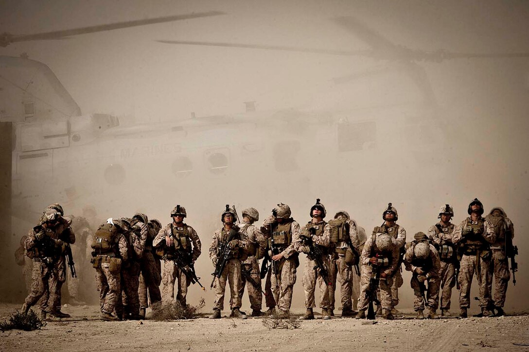 Marines with Lima Company, Battalion Landing Team 3/5, 15th Marine Expeditionary Unit (MEU), wait to load a CH-46E Sea Knight for fast-rope training during Exercise Red Reef 13, in the Kingdom of Saudi Arabia, Jan. 7, 2013. Red Reef is a bilateral amphibious exercise between the 15th MEU and Saudi forces that focuses on expanding levels of cooperation, enhancing mutual maritime capabilities, as well as promoting long-term regional stability and interoperability between U.S. forces and the Kingdom of Saudi Arabia. The 15th MEU is deployed as part of the USS Peleliu Group, and is scheduled to complete its eight-month deployment and return to Marine Corps Air Station Camp Pendleton Sept. 13. (U.S. Marine Corps photo by Cpl. Bobby J. Gonzalez/Released)