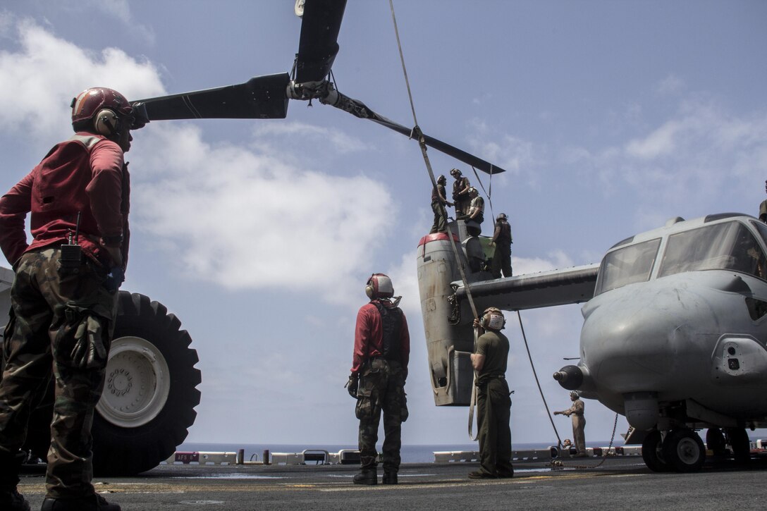U.S. Marines with Medium Tiltrotor Squadron 266 (Reinforced), 26th Marine Expeditionary Unit (MEU) and Sailors assigned to the USS Kearsarge (LHD 3) move a rotor for an MV-22 Osprey on the flight deck of the USS Kearsarge, at sea, May 4, 2013. The 26th MEU is deployed to the 5th Fleet area of operations aboard the Kearsarge Amphibious Ready Group. The 26th MEU operates continuously across the globe, providing the president and unified combatant commanders with a forward-deployed, sea-based quick reaction force. The MEU is a Marine Air-Ground Task Force capable of conducting amphibious operations, crisis response and limited contingency operations. (U.S. Marine Corps photograph by Gunnery Sgt. Michael Kropiewnicki/26th MEU Combat Camera/Released)