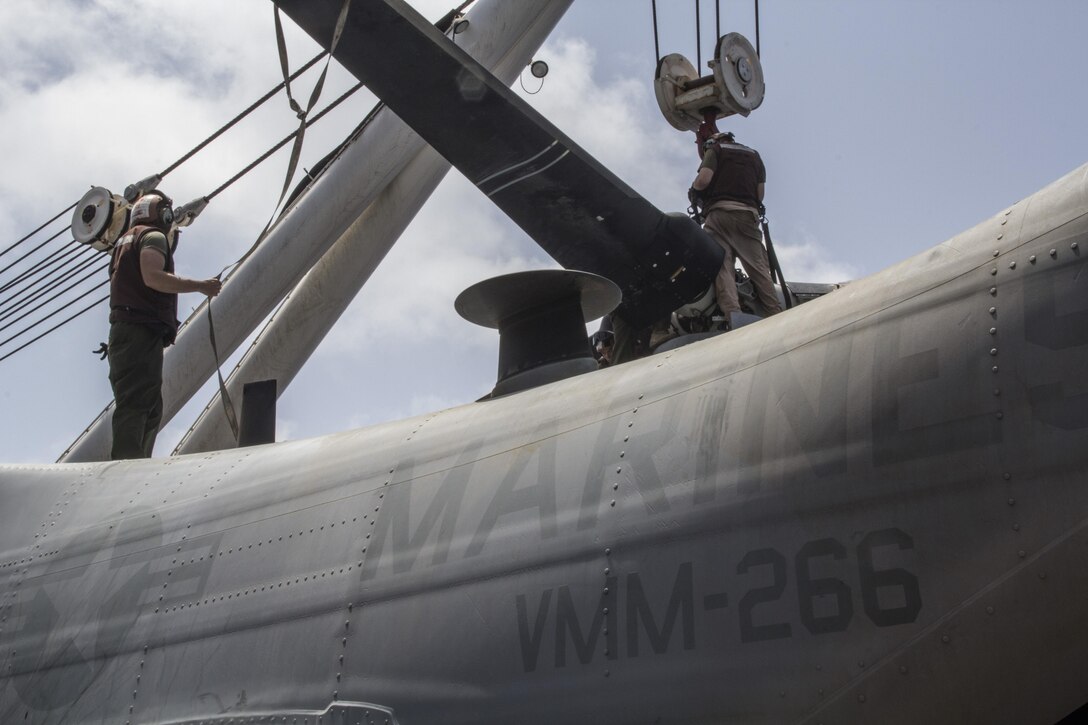 U.S. Marines with Medium Tiltrotor Squadron 266 (Reinforced), 26th Marine Expeditionary Unit (MEU) mount a rotor of an MV-22 Osprey on the flight deck of the USS Kearsarge (LHD 3), at sea, May 4, 2013. The 26th MEU is deployed to the 5th Fleet area of operations aboard the Kearsarge Amphibious Ready Group. The 26th MEU operates continuously across the globe, providing the president and unified combatant commanders with a forward-deployed, sea-based quick reaction force. The MEU is a Marine Air-Ground Task Force capable of conducting amphibious operations, crisis response and limited contingency operations. (U.S. Marine Corps photograph by Gunnery Sgt. Michael Kropiewnicki/26th MEU Combat Camera/Released)