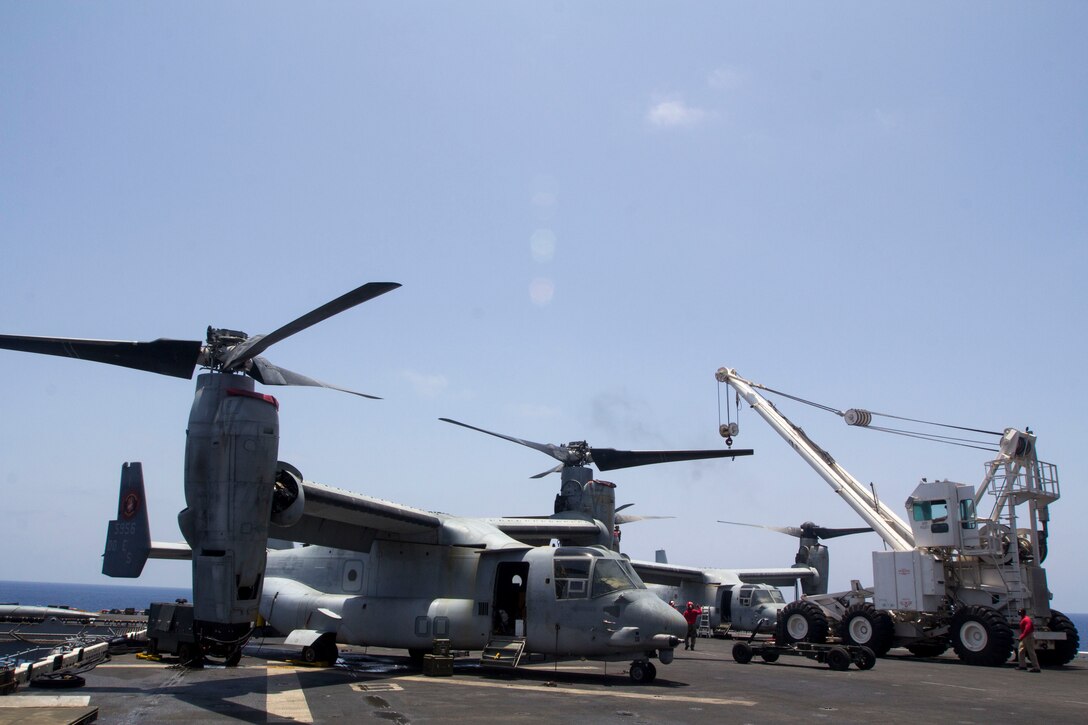 U.S. Marines with Medium Tiltrotor Squadron 266 (Reinforced), 26th Marine Expeditionary Unit (MEU), and Sailors assigned to the USS Kearsarge (LHD 3) move a rotor for an MV-22 Osprey on the flight deck of the USS Kearsarge, at sea, May 4, 2013. The 26th MEU is deployed to the 5th Fleet area of operations aboard the Kearsarge Amphibious Ready Group. The 26th MEU operates continuously across the globe, providing the president and unified combatant commanders with a forward-deployed, sea-based quick reaction force. The MEU is a Marine Air-Ground Task Force capable of conducting amphibious operations, crisis response and limited contingency operations. (U.S. Marine Corps photograph by Cpl. Kyle N. Runnels/Released)