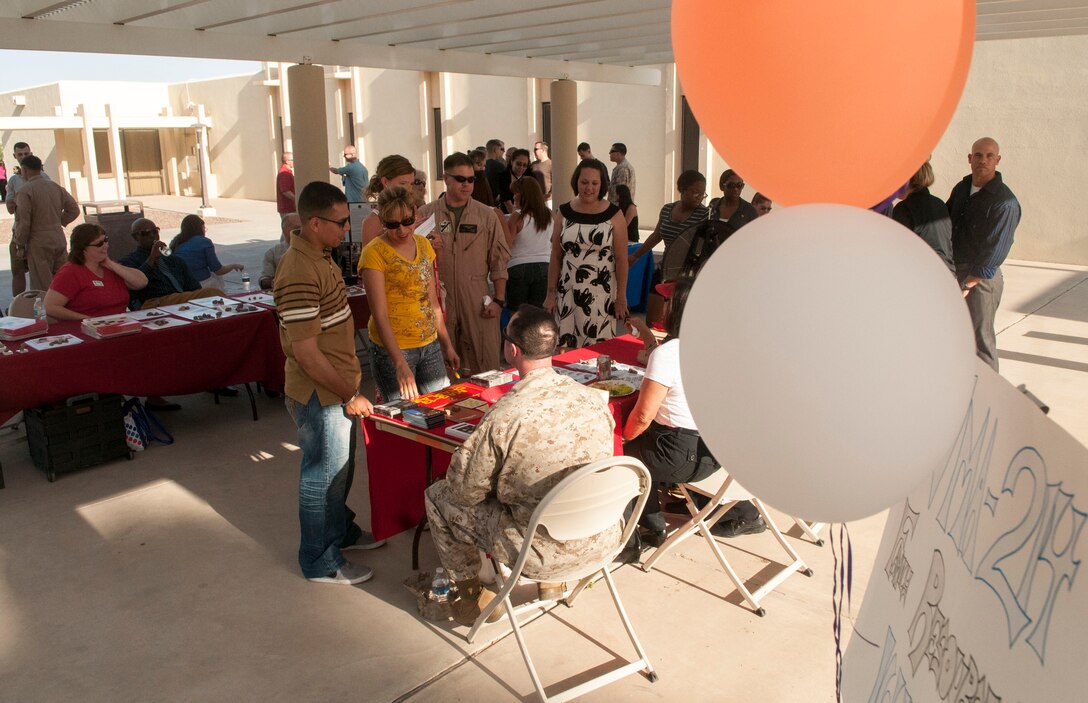 Marines, Sailors and family members of Marine Attack Squadron 214, Marine Attack Squadron 211, Marine Attack Squadron 311 and Marine Aviation Logistics Squadron 13 were brought together for a cross-squadron pre-deployment brief and family barbecue at Marine Corps Air Station Yuma’s base chapel courtyard, May 1. The event included a resource fair for Marines and families looking for information on what they can count on from station support groups.