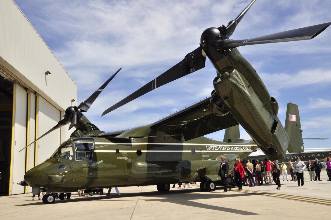 Marine Helicopter Squadron One Marines, past and present, family members and friends mingle on the flight line with the newest addition to the squadron, a MV-22 B ‘Osprey,’ after a MV-22B Introduction Ceremony in the HMX-1 hangar on May 4, 2013. HMX-1 is scheduled to receive 11 more MV-22B by next summer.