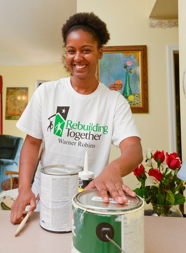 U.S. Air Force 2nd Lt. Shantel Gibson, from the 116th Air Control Wing, Georgia Air National Guard, prepares to start painting the interior of a local home, Warner Robins, Ga., April 27, 2013.  Gibson and four other Airmen from the wing, volunteered with the Rebuilding Together Warner Robins non-profit organization to provide free home repairs to a local low-income household.  (U.S. Air National Guard photo by Master Sgt. Roger Parsons/Released)