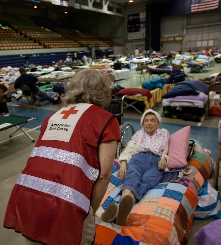 Dona Young (right) talks with Red Cross volunteer, Heather Ellis, at the Red Cross shelter in South Minot. Mrs. Young's house was inundated with water from the Souris River and she was forced to evacuate. Burleigh and Ward counties were designated a Federal disaster area.