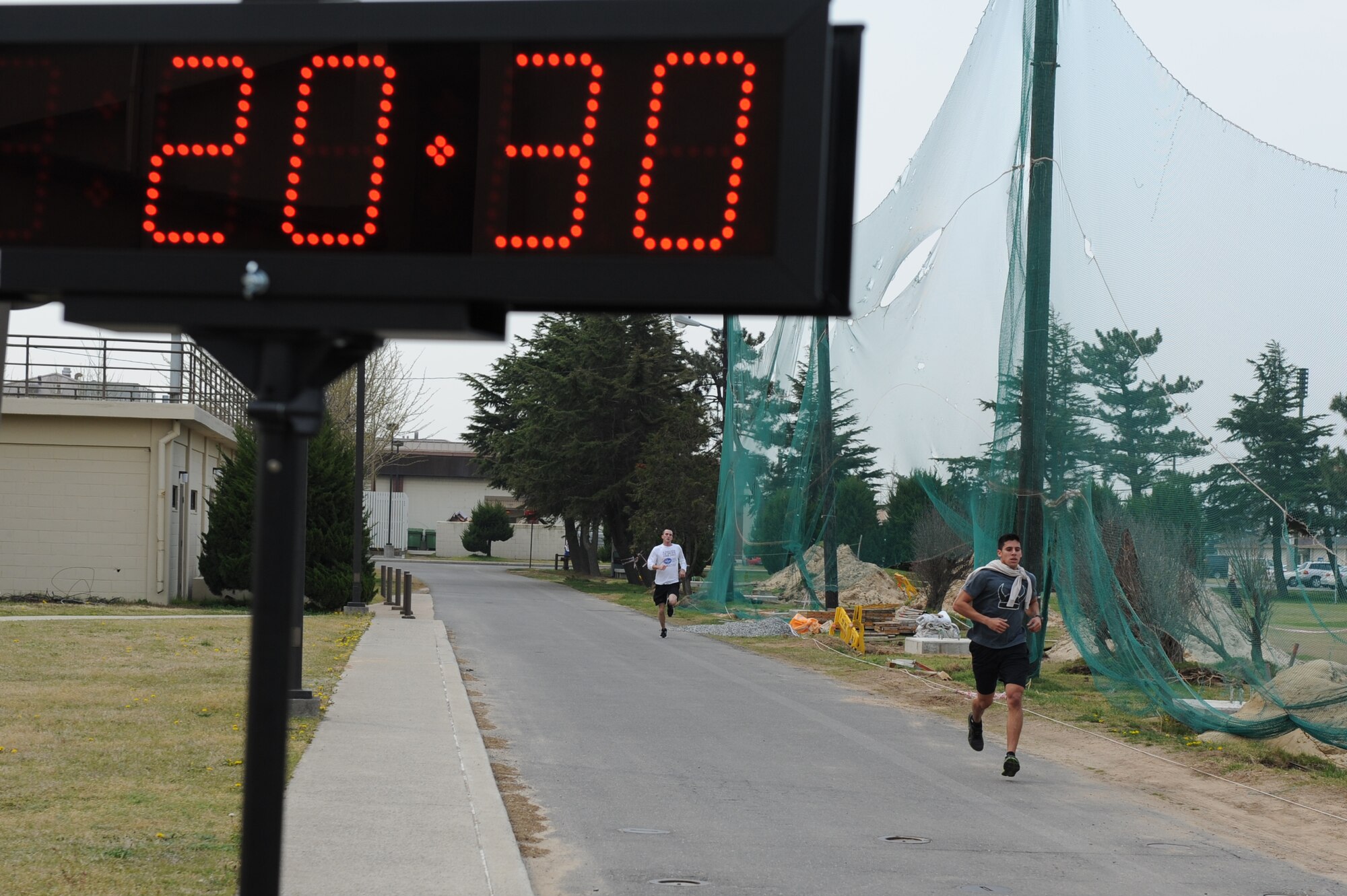 KUNSAN AIR BASE, Republic of Korea -- Staff Sgt. Mark Benavides, 80th Aircraft Maintenance Unit, sprints for the finish line during the April Fools Fun Run at Kunsan Air Base, Republic of Korea, April 27, 2013. Benavides was the first male runner to complete the 5 kilometer run with a time of 20:33. (U.S. Air Force photo by Staff Sgt. Jonathan Fowler/Released)