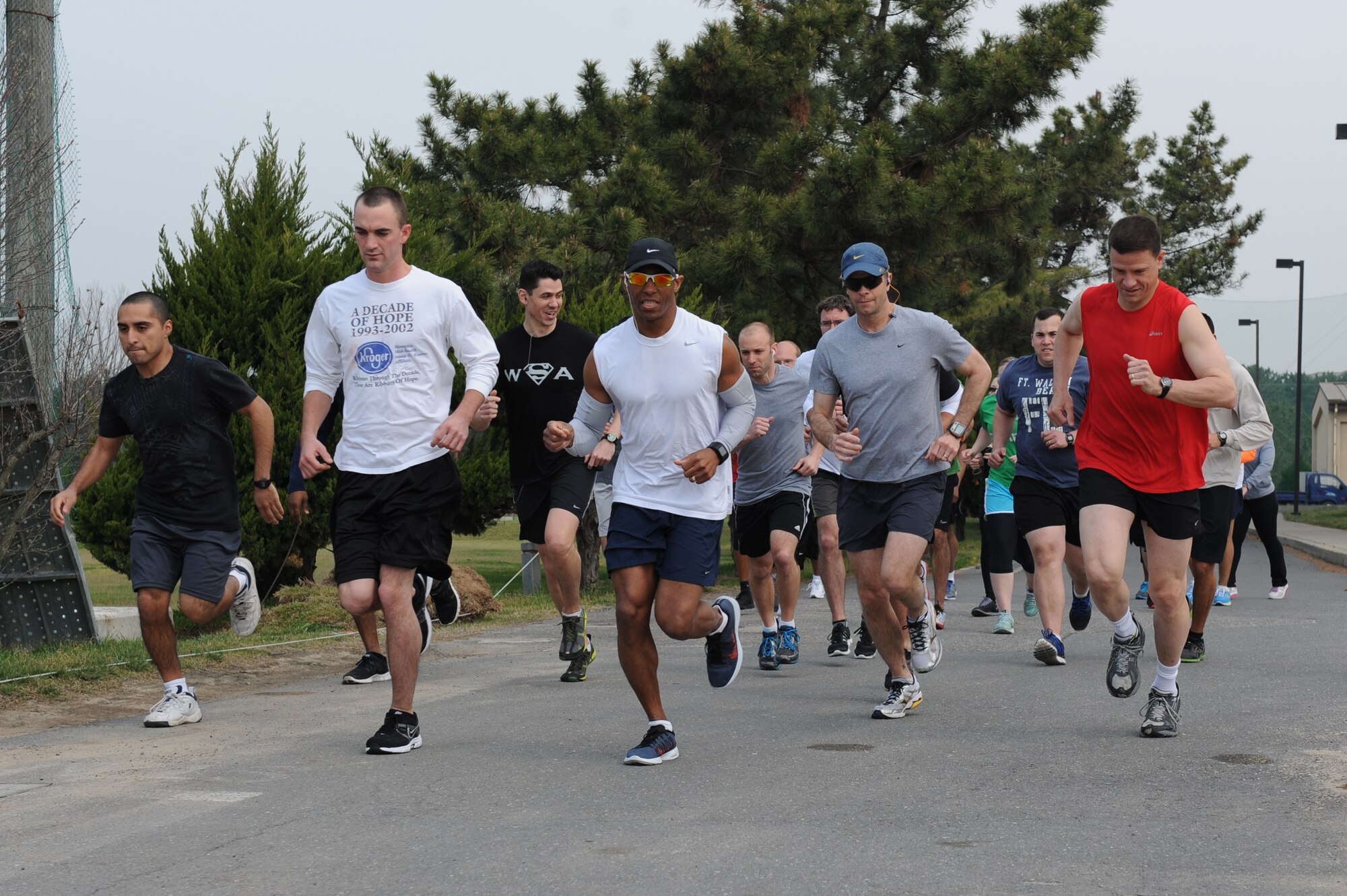 KUNSAN AIR BASE, Republic of Korea -- 8th Fighter Wing Members take off at the start of the April Fools Fun Run at Kunsan Air Base, Republic of Korea, April 27, 2013. More than 25 people participated in the event, which had a 10 kilometer and 5 kilometer race. (U.S. Air Force photo by Staff Sgt. Jonathan Fowler/Released)