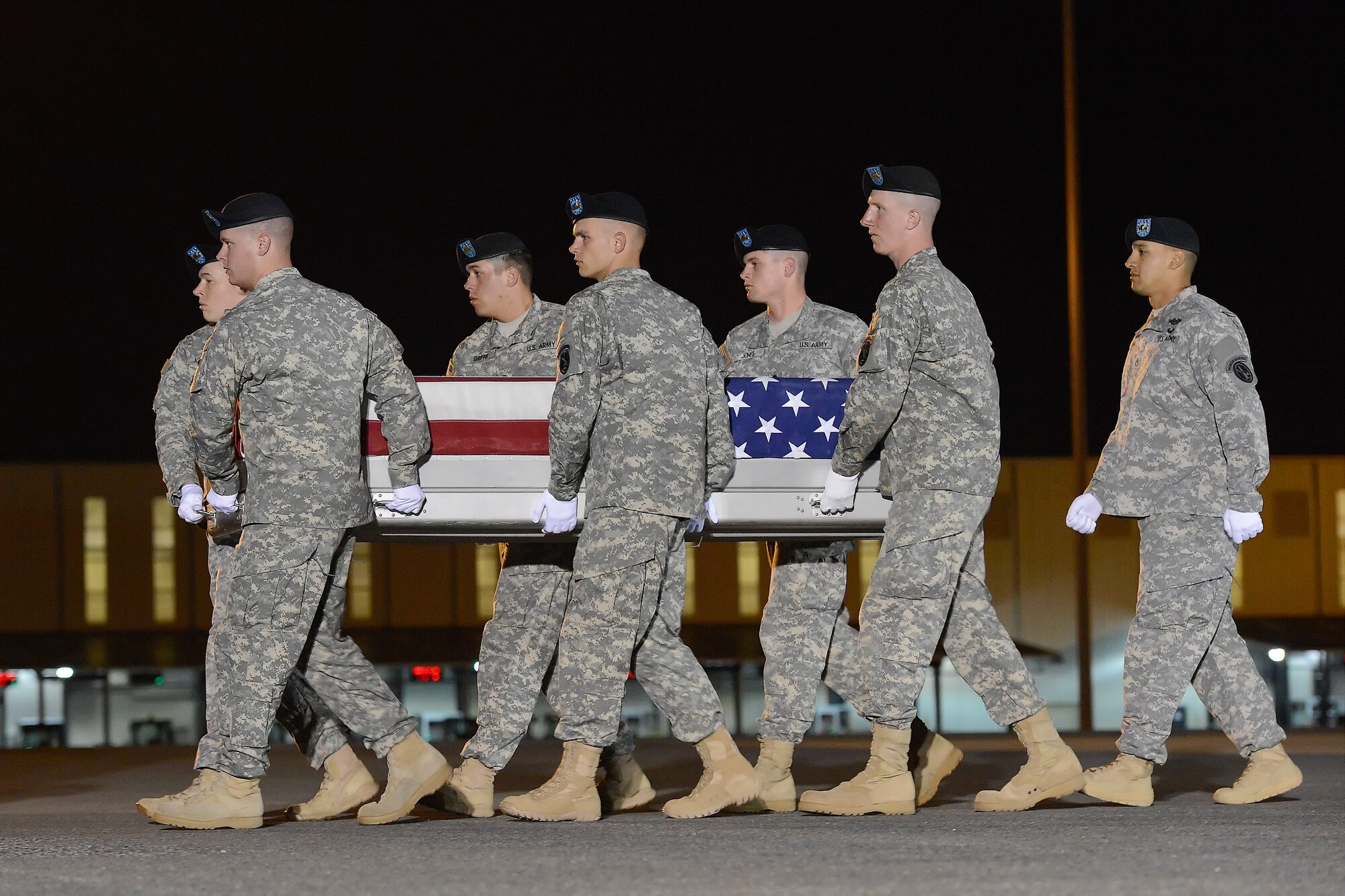 A U.S. Army carry team transfers the remains of Spc. Trinidad Santiago Jr. of San Diego, Calif., during a dignified transfer May 4, 2013 at Dover Air Force Base, Del. Santiago was assigned to 4th Battalion, 42nd Field Artillery Regiment, 1st Combat Team, 4th Infantry Division, Ft. Carson, Colo. (U.S. Air Force photo/Greg L. Davis)