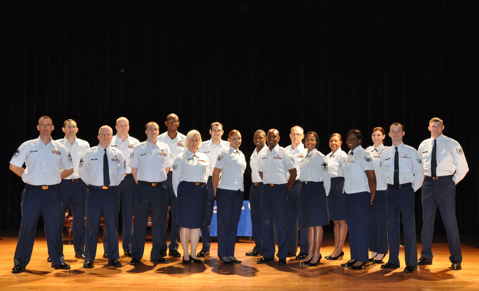 Airmen assigned to the 315th Airlift Wing at Joint Base Charleston - Air Base, S.C. celebrate their graduation from the Community College of the Air Force during the commencement ceremony at the base theatre here Sunday, May 5, 2013.