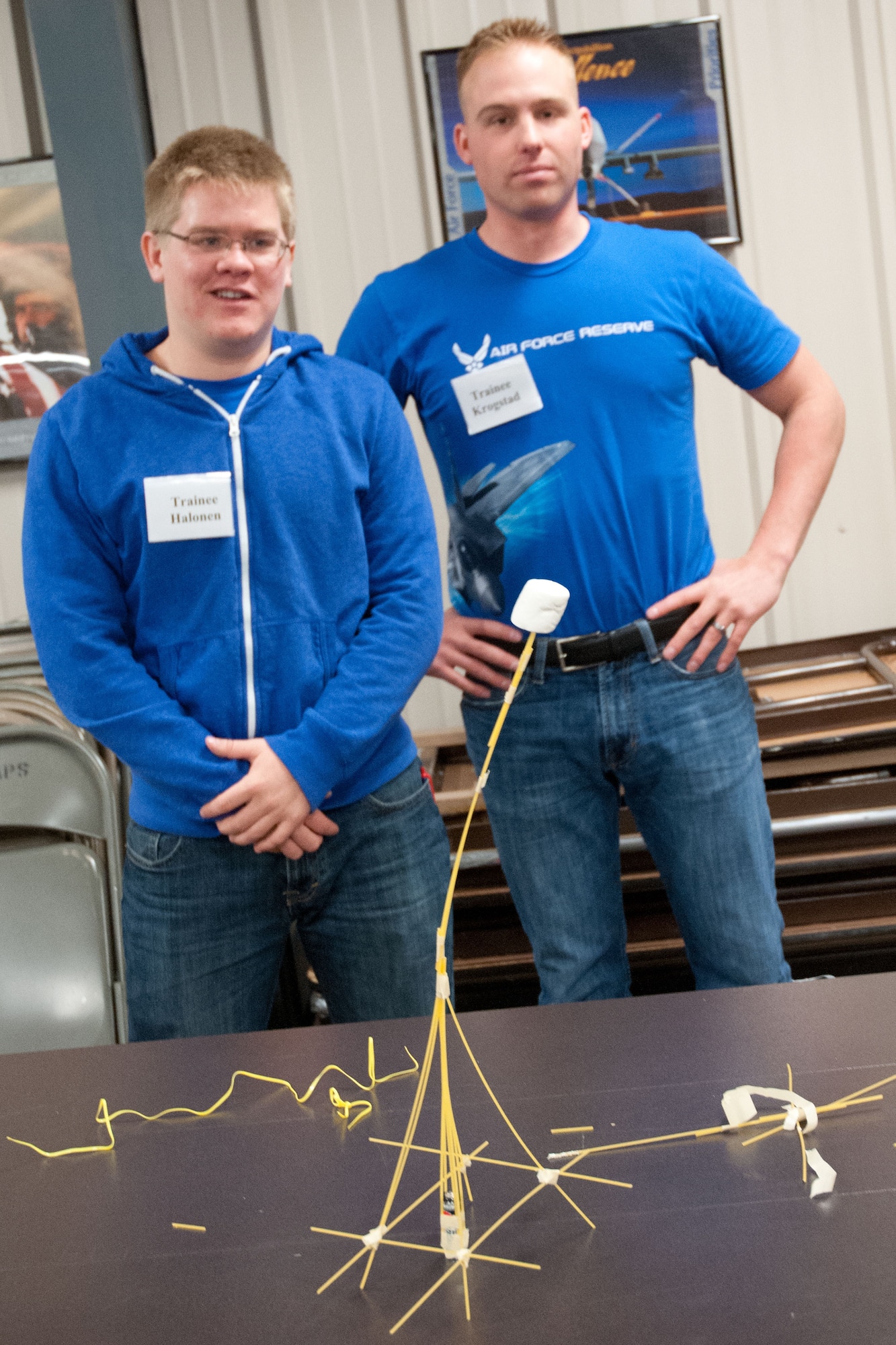 Trainees Tyler Halonen and Nathan Krogstad show off their first place structure.  Members of the 934th Airlift Wing Development Training Flight competed in a marshmallow challenge on May 5, at the Minneapolis-St. Paul Air Reserve Station, Minn.  The challenge was to build the tallest free standing structure strong enough to hold a marshmallow and tested trainees on problem solving, making assumptions, and teamwork.  (US Air Force Photo/Staff Sgt. Samantha Wagner)