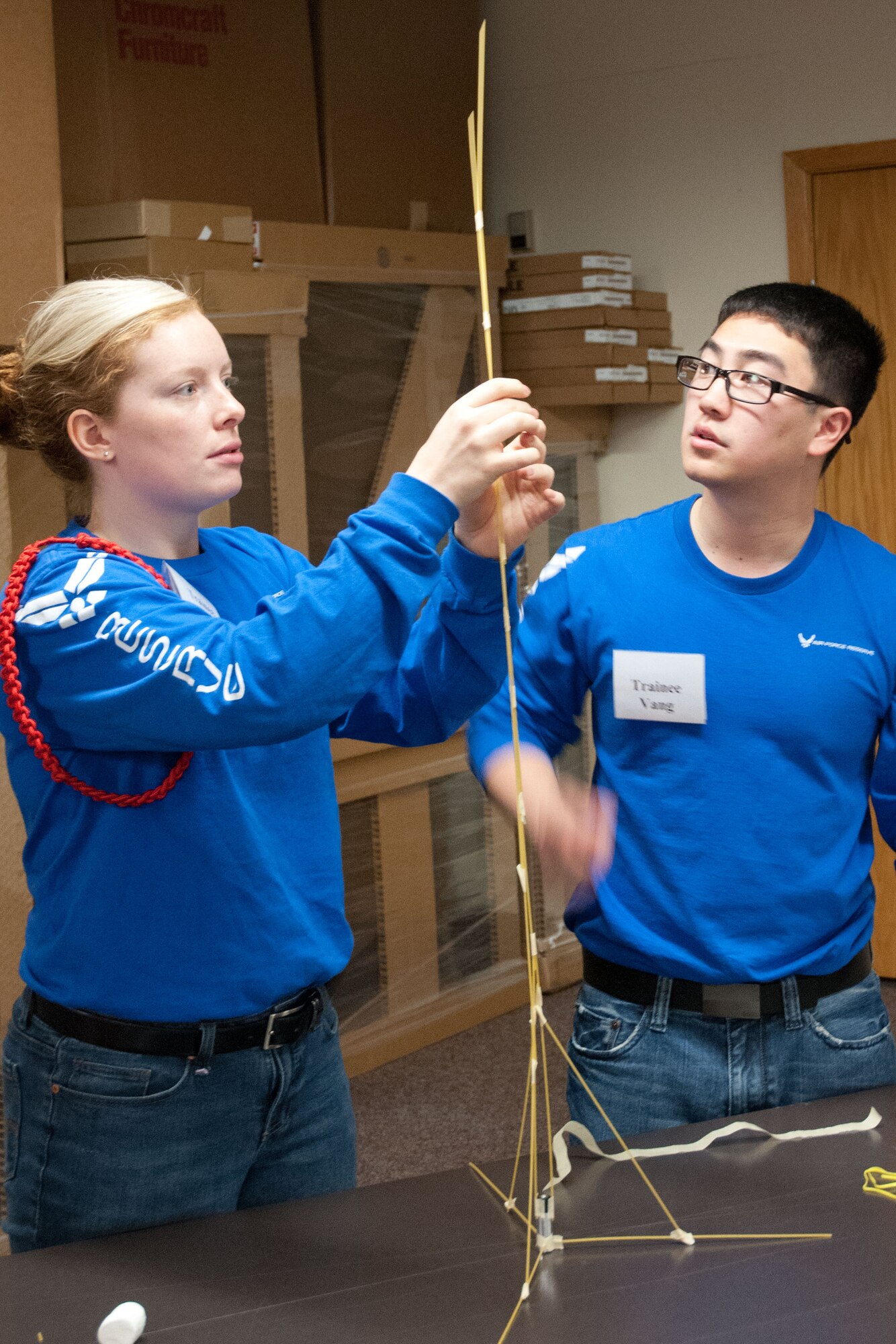 Trainees Keirsten Englund and Larlee Vang work together to create the tallest free standing structure able to hold a marshmallow.  Members of the 934th Airlift Wing Development Training Flight competed in a marshmallow challenge on May 5, at the Minneapolis-St. Paul Air Reserve Station, Minn.  The challenge was to build the tallest free standing structure strong enough to hold a marshmallow and tested trainees on problem solving, making assumptions, and teamwork.  (US Air Force Photo/Staff Sgt. Samantha Wagner)