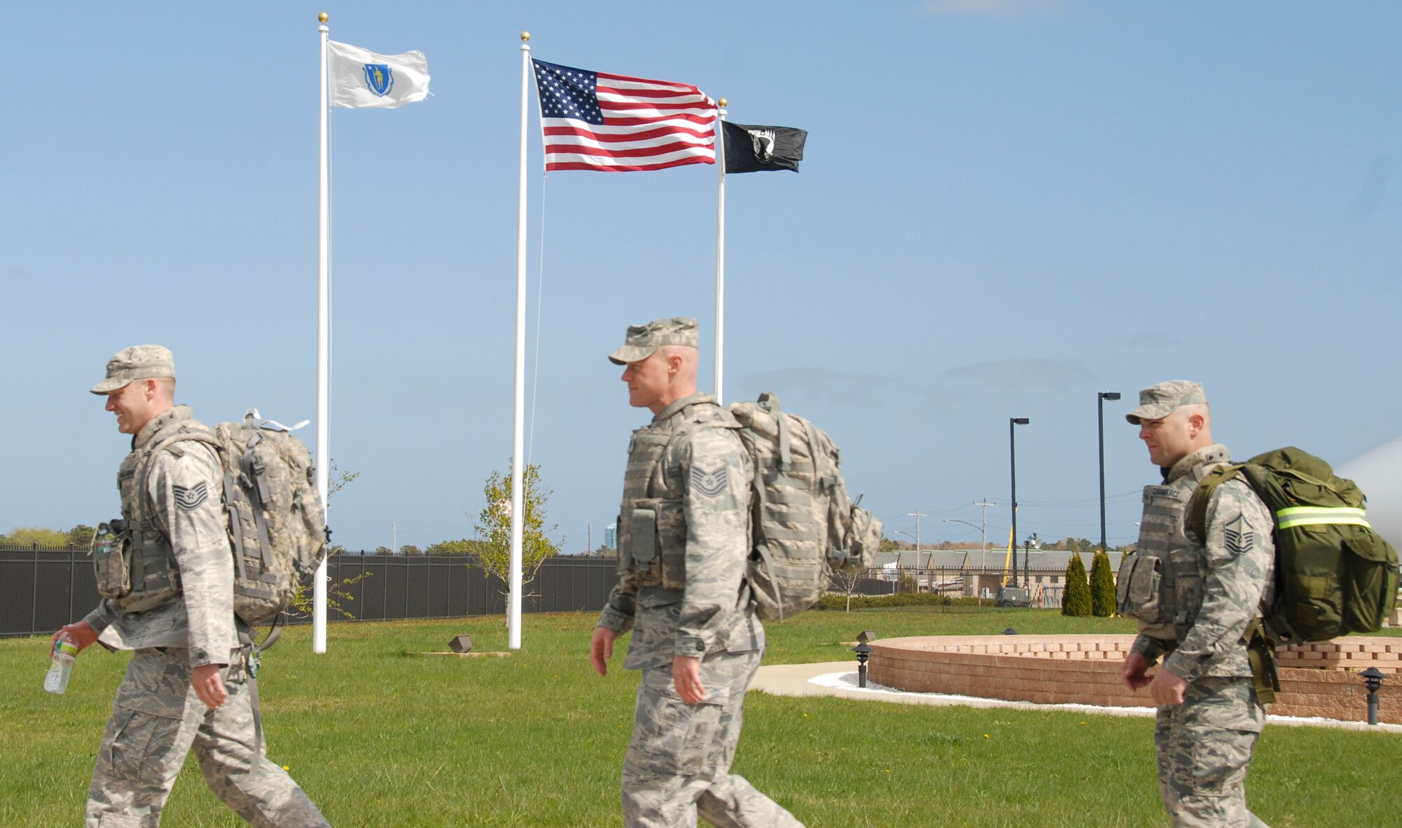 More than 30 members of the 102nd Security Forces Squadron took part in a ruck march around Otis Air National Guard Base, Mass.  May 4, 2013. The approximately four mile march took the place of the squadron’s usual physical training session and required each 102 SFS defender to carry more than 30 pounds of gear on their back. Staff Sgt. Gary Bent, 102 SFS, who recently finished first in the ruck march race at the Massachusetts National Guard Best Warrior Competition, planned the march’s route and format. (U.S. Air National Guard photo by Senior Airman Patrick McKenna)