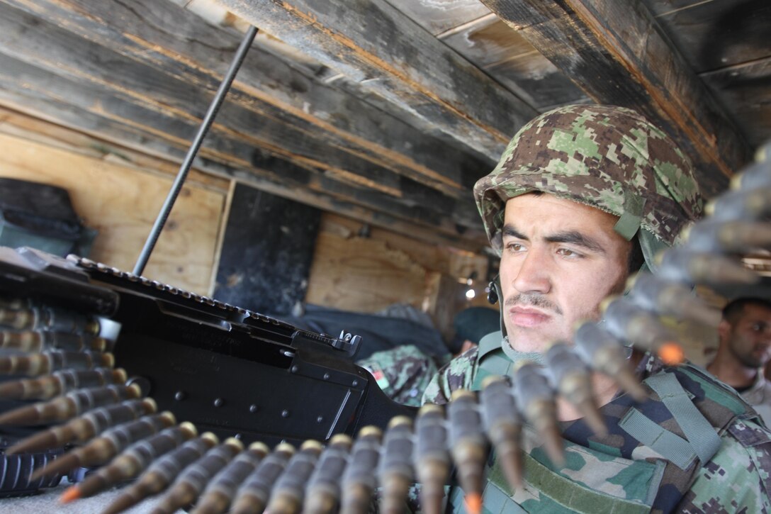 An Afghan National Army soldier mans one of many guard posts at Forward Operating Base Nolay, Sangin District, Helmand province, Afghanistan, March 25. The 2nd Brigade, 215th Corps Security Force Assistance Advisor Team arrived in November to guide, advise and assist the ANA. The SFAAT was created to get the ANA and other Afghan National Security Forces to think on their own as Coalition Forces take a step back and go from the "shoulder-to-shoulder" approach to "over-the-shoulder."
