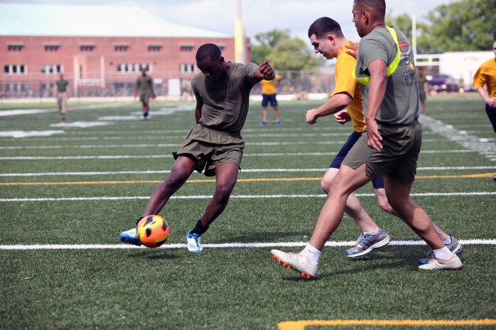 A Marine with Combat Logistics Regiment 27, 2nd Marine Logistics Group dribbles the soccer ball to score during a soccer game at the unit’s field meet aboard Camp Lejeune, N.C., May 1, 2013. Marines and sailors with CLR-27’s soccer team moved on to the championship round after beating more than five teams within the MLG.