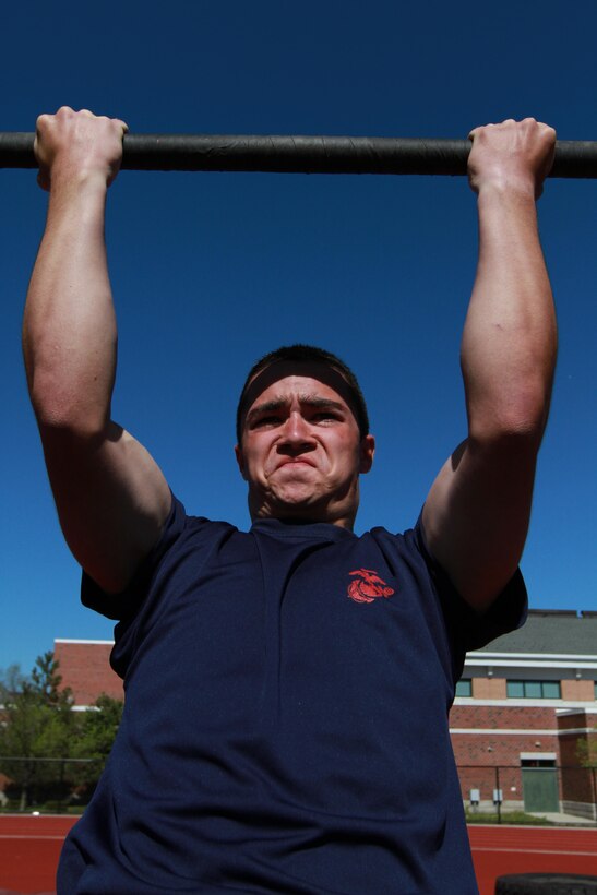 Chris Byrne, a 18-year-old Longmeadow, Mass., native, grimaces while preforming pull-ups during the 2013 Annual Field Meet, at Chicopee High School’s Football Field, May 4, 2013. Approximately 600 newly enlisted men and women from across New England, to include; Western Massachusetts, Connecticut, Vermont and Rhode Island, attended the event. The annual Marine Corps event is designed to test the Poolees’ physical fitness with a pull-up and sit-up competition to ensure that they are prepared for the rigors of Marine Corps boot camp. (Official Marine Corps Photo by Sgt. Richard Blumenstein)