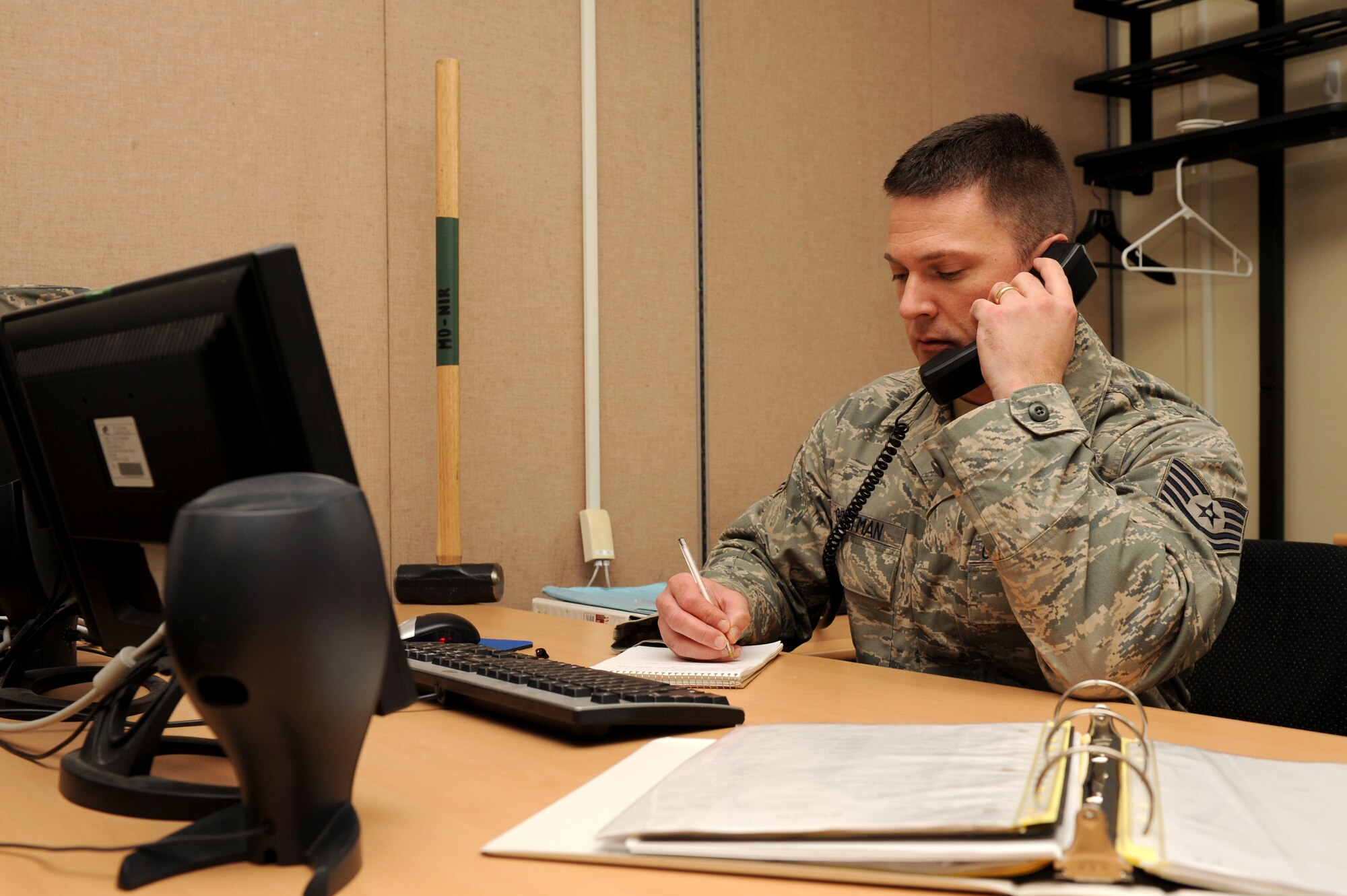 KUNSAN AIR BASE, Republic of Korea -- Tech. Sgt. Donald Gettman, 8th Force Support Squadron manpower technician, assists a customer on the phone at Kunsan Air Base, Republic of Korea, May 2, 2013. Gettman was named Kunsan’s “Pride of the Pack” winner April 15-19. (U.S. Air Force photo by Staff Sgt. Jonathan Fowler/Released)