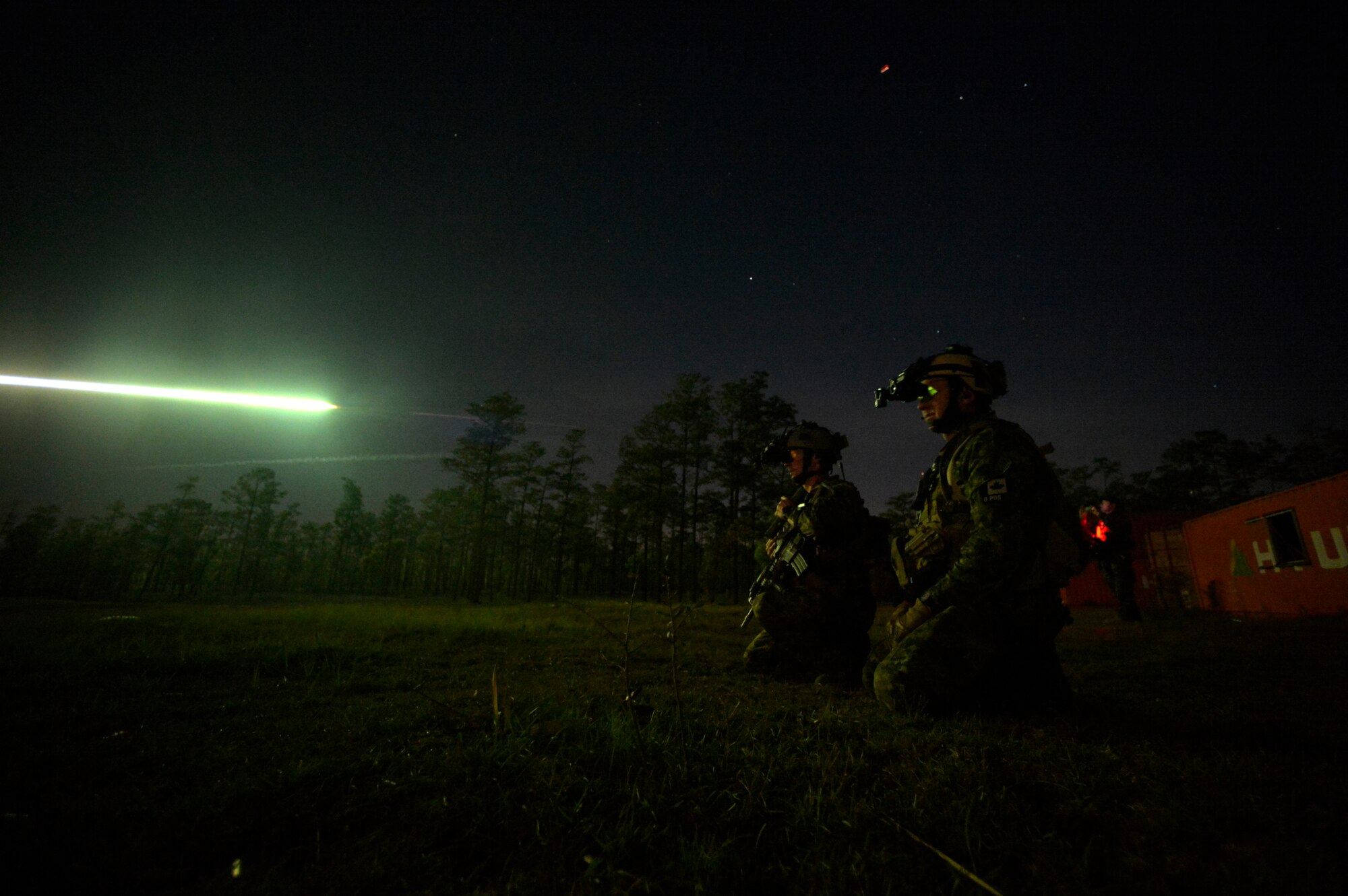 Canadian special operation regiment members call in close air support from their U.S. Air Force allies during Emerald Warrior 2013, Hurlburt Field, Fla., April 26. The primary purpose of Emerald Warrior is to exercise special operations components in urban and irregular warfare settings to support combatant commanders. Emerald Warrior leverages lessons from Operation Iraqi Freedom,Operation Enduring Freedom and other historical lessons to provide better trained and ready forces to combatant commanders. (U.S. Air Force photo by Senior Airman Matthew Bruch)(Released)