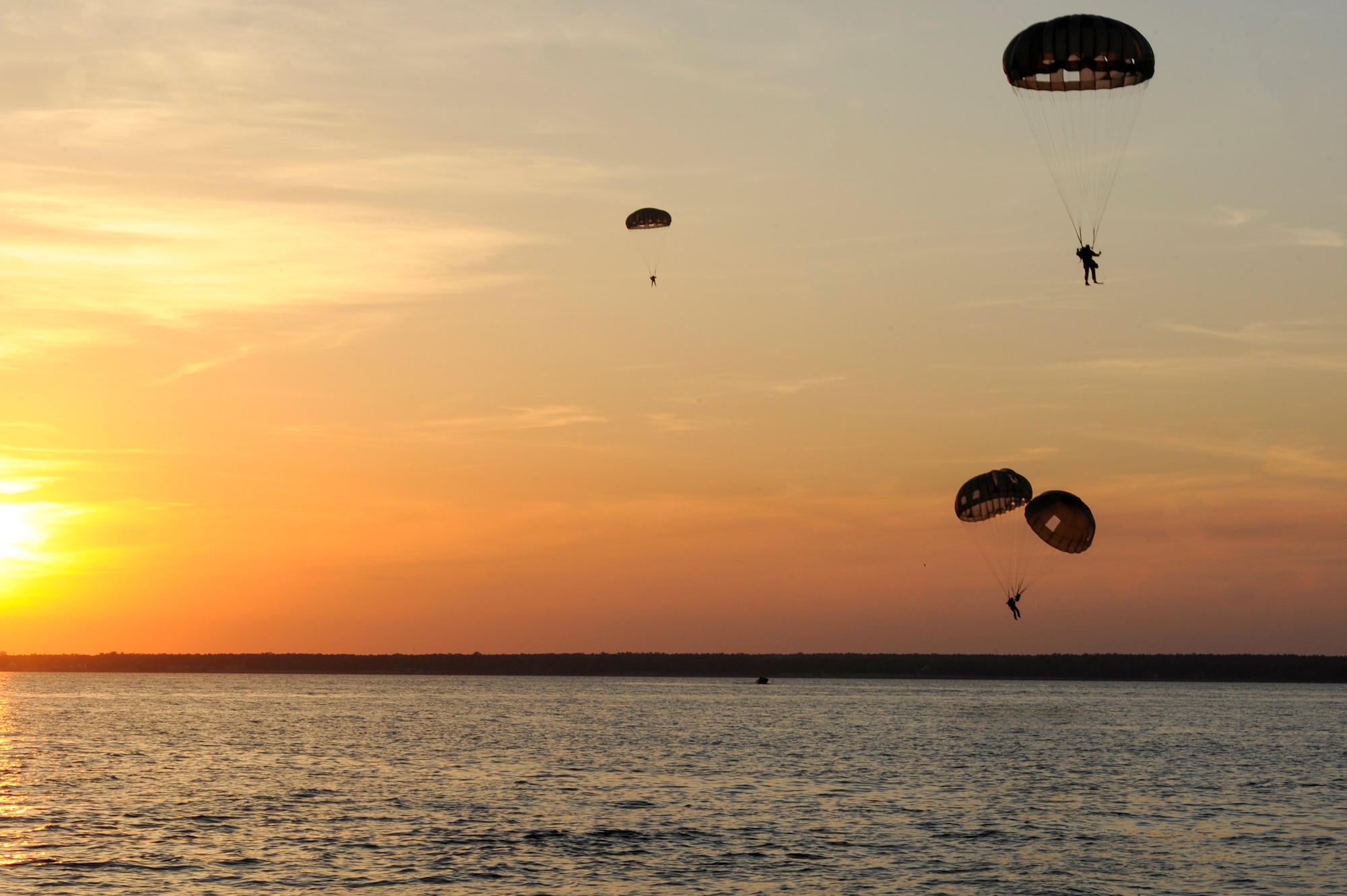 U.S. Army special operators parachute out of a U.S. Air Force C-17 Globemaster III to perform a training mission during Emerald Warrior 2013, Hurlburt Field, Fla., April 26. The primary purpose of Emerald Warrior is to exercise special operations components in urban and irregular warfare settings to support combatant commanders. Emerald Warrior leverages lessons from Operation Iraqi Freedom,Operation Enduring Freedom and other historical lessons to provide better trained and ready forces to combatant commanders. (U.S. Air Force photo by Senior Airman Colville McFee)(Released)