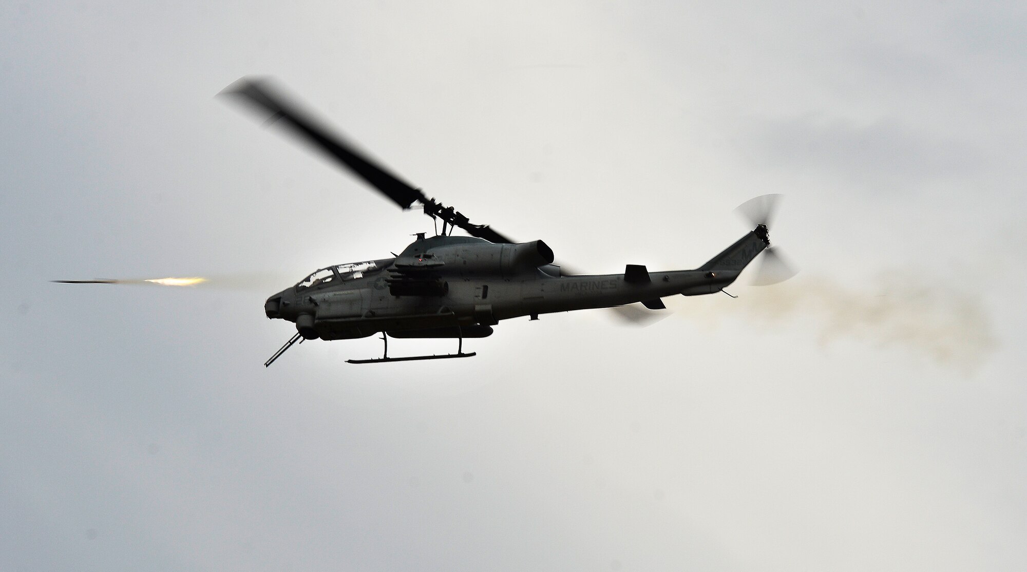 A U.S. Marine Corps AH-1 Cobra provides close air support during Emerald Warrior 2013 at Hurlburt Field, Fla., April 24. The primary purpose of Emerald Warrior is to exercise special operations components in urban and irregular warfare settings to support combatant commanders. Emerald Warrior leverages lessons from Operation Iraqi Freedom,Operation Enduring Freedom and other historical lessons to provide better trained and ready forces to combatant commanders.(U.S. Air Force photo by Staff Sgt. Vernon Young Jr.)(Released)