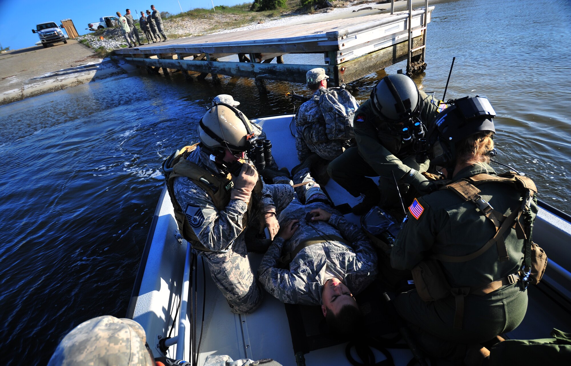 U.S. Air Force Special Operations Medical Element teams from Air Force Special Operations Command simulate wounded personnel recovery procedures while Soldiers from the 6th Ranger Battalion provide security during Emerald Warrior 2013 at Hurlburt Field, Fla., April 23. The primary purpose of Emerald Warrior is to exercise special operations components in urban and irregular warfare settings to support combatant commanders. Emerald Warrior leverages lessons from Operation Iraqi Freedom, Operation Enduring Freedom and other historical lessons to provide better trained and ready forces to combatant commanders. (U.S. Air Force photo by Staff Sgt. Elizabeth Rissmiller)(Released)