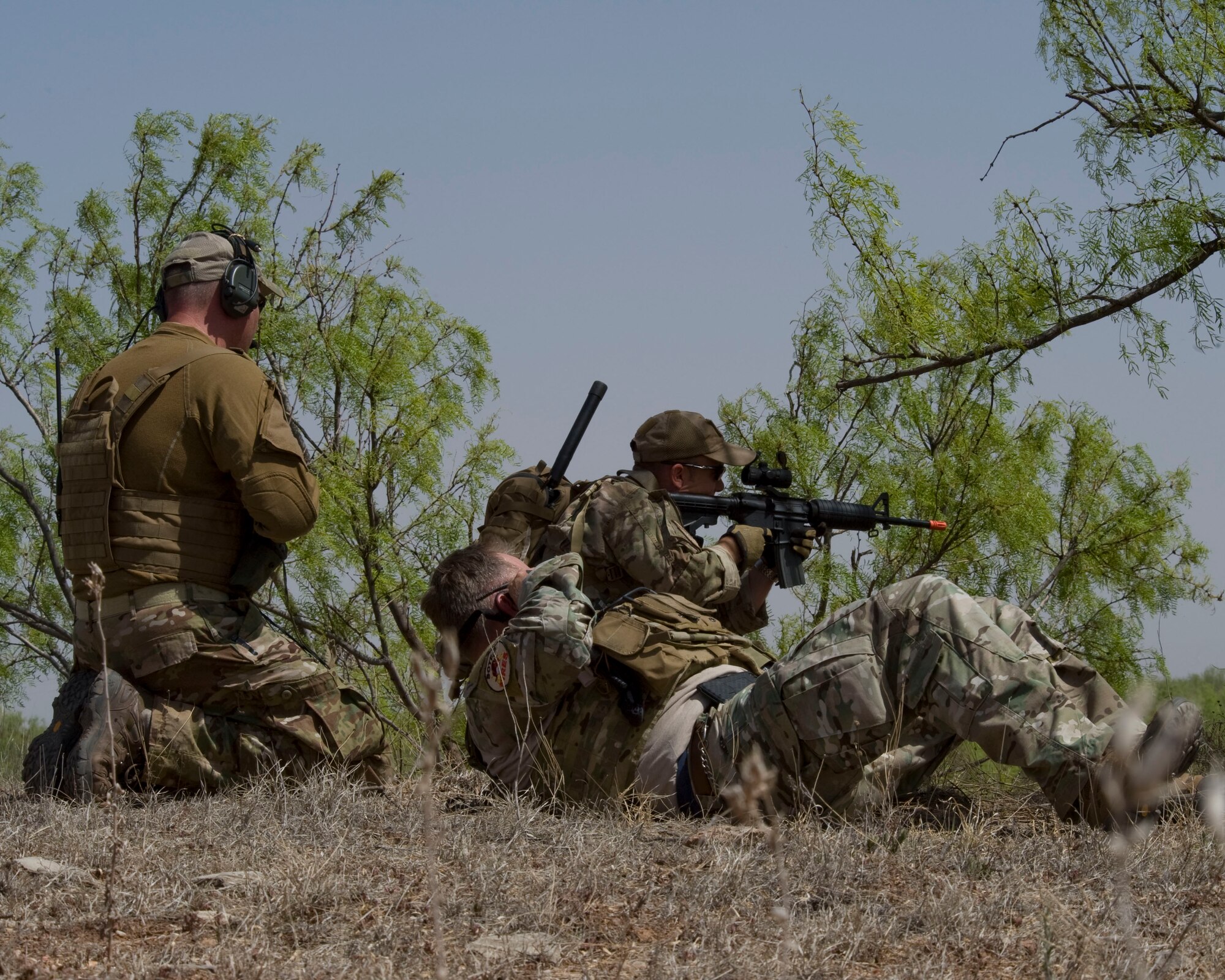 U.S. Air Force and U.S. Army Joint Terminal Attack Controllers (JTACs) defend their position while directing close air support from Dyess Air Force Base, Texas, B-1 Bombers during a joint training exercise May 1, 2013, near Snyder, Texas. The exercise was conducted to prepare B-1 aircrews for future contingency operations and to keep JTACs proficient with their combat skills. (U.S. Air Force photo by Staff Sgt. Richard Ebensberger/Released)