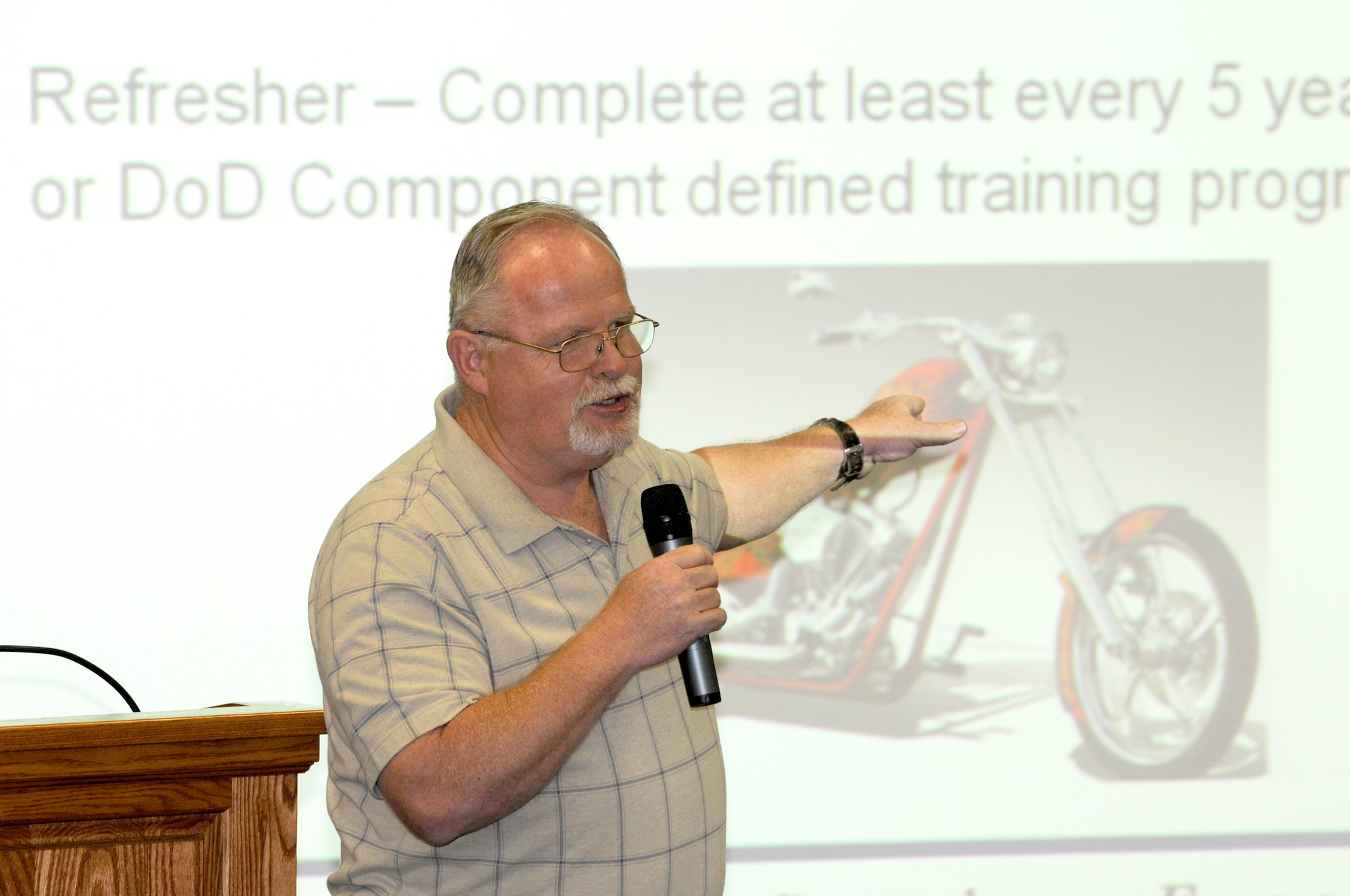 Arthur Albert, the Air Force Safety Center motorcycle safety representative and Air Force program manager, reviews updated policies and regulations related to motorcycle riding during the Air Force Safety Center annual preseason motorcycle safety briefing held April 25 at the safety center. (U.S. Air Force photo by Keith A. Wright)