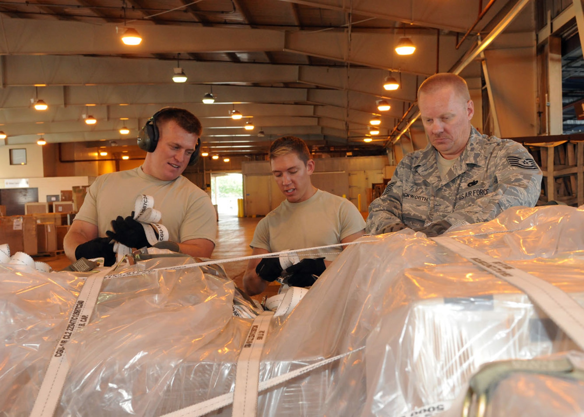 Tech. Sgt. John Garrelts, 86th Aerial Port Squadron, Joint Base Lewis-McChord, Wash., inventories a supply pallet destined to Marine Corps Air Station, Iwakuni, Japan, May, 2. The 86th APS conducted annual upgrade, continuous, and proficiency training with the 735th Air Mobility Squadron at Joint Base Pearl Harbor-Hickam, Hawaii.